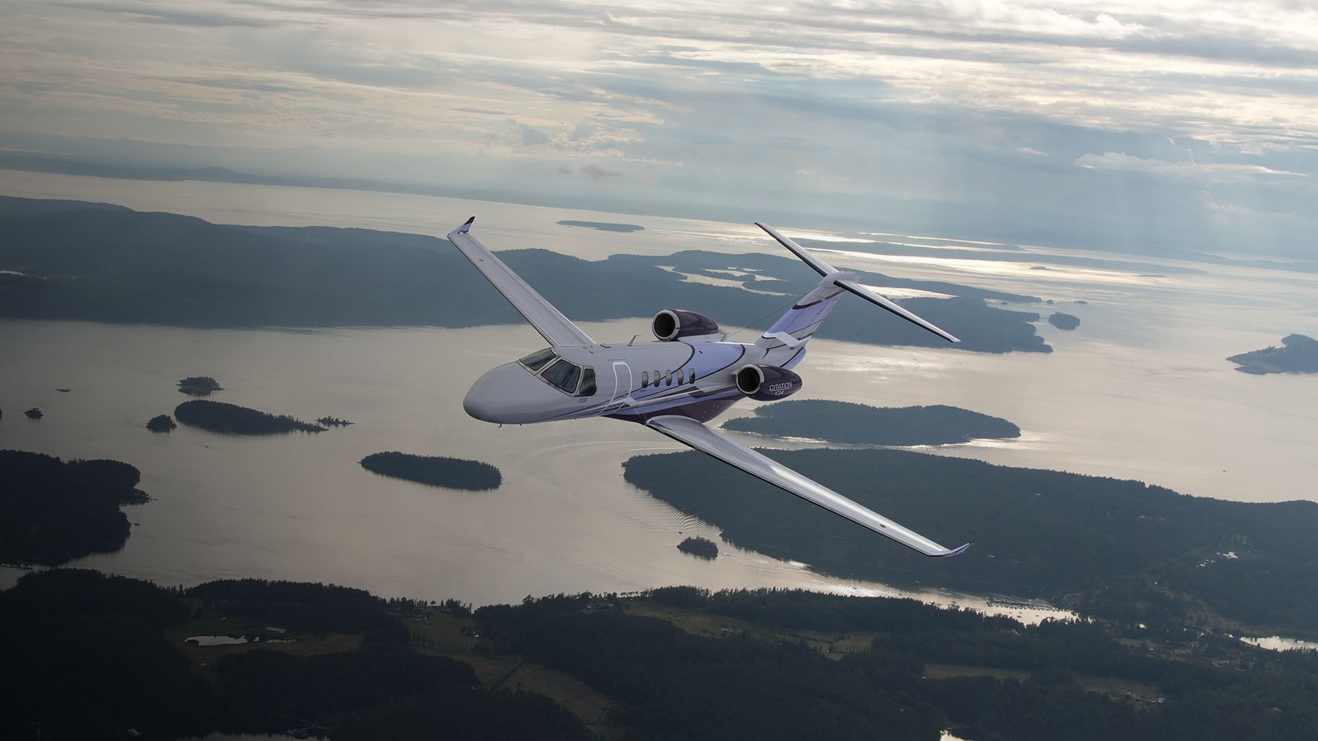 an abstract photo of a curved building with a blue sky in the background