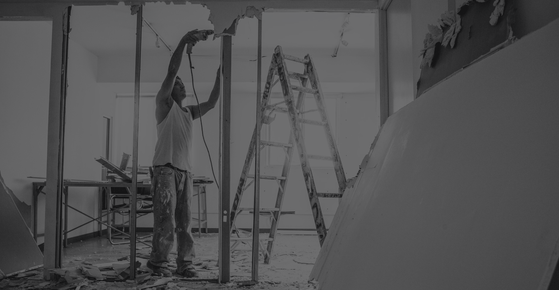 Concrete worker removing concrete structure for restoration