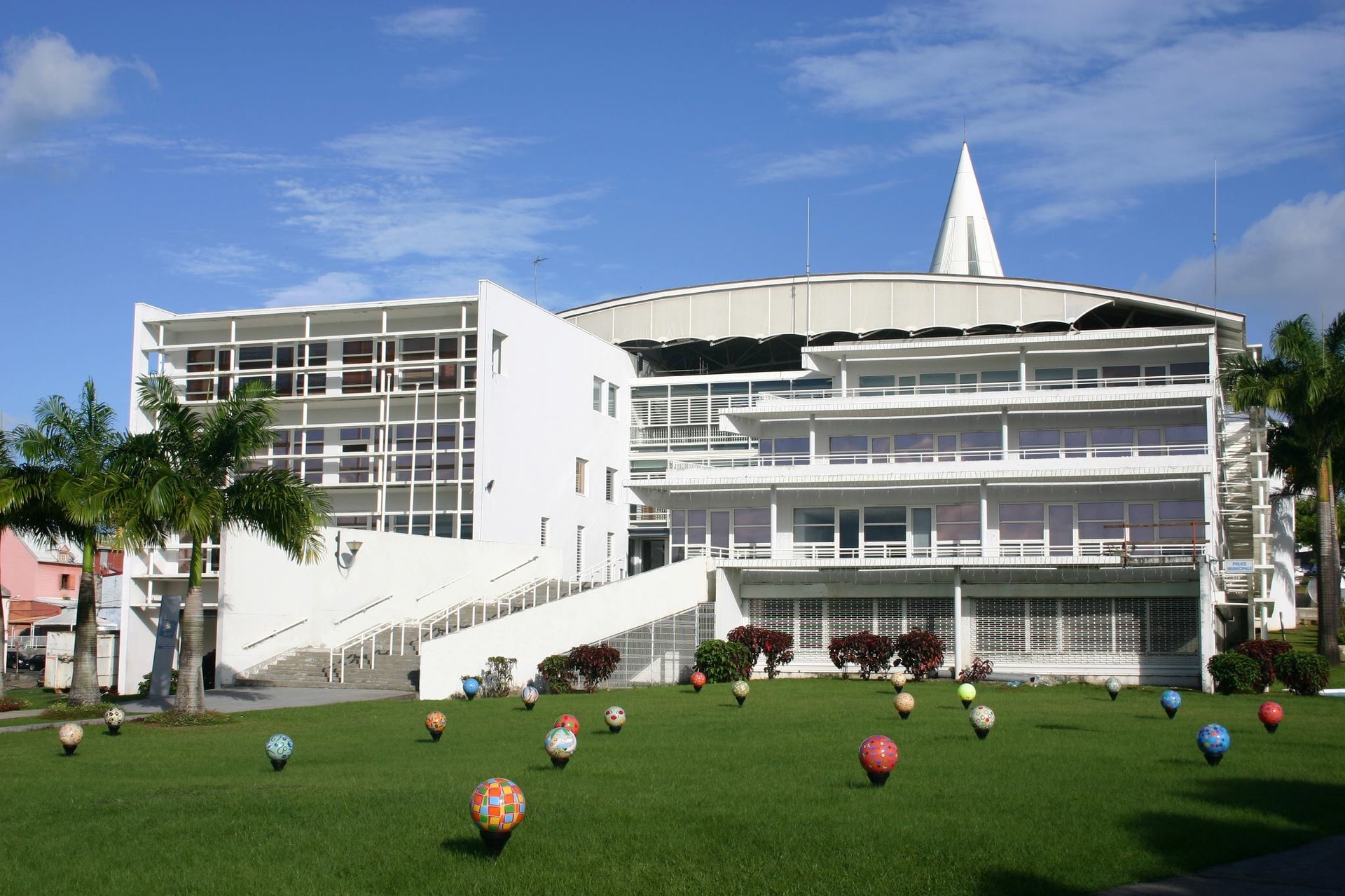 a small building in a grassy field