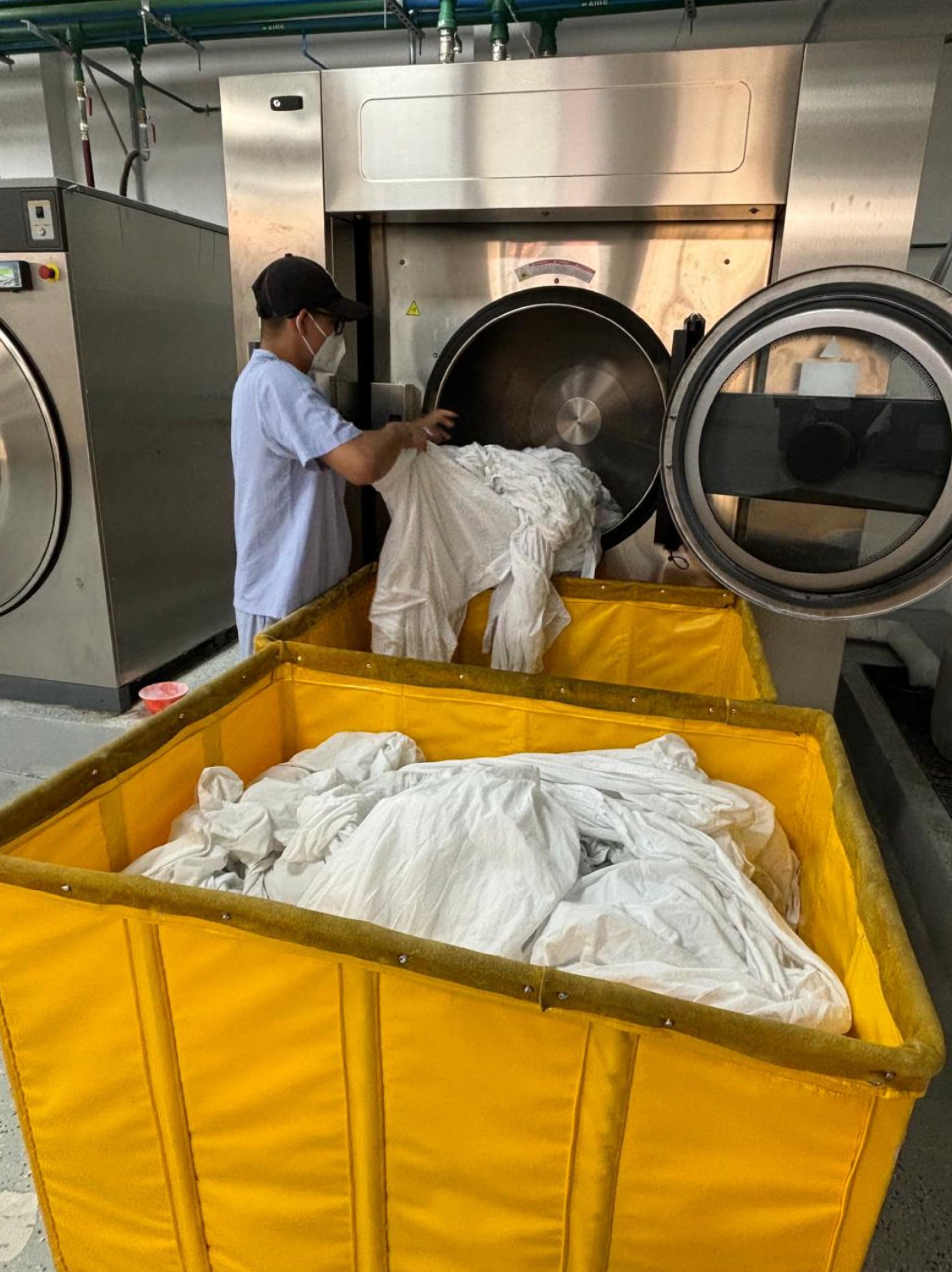 woman wearing yellow long-sleeved dress under white clouds and blue sky during daytime