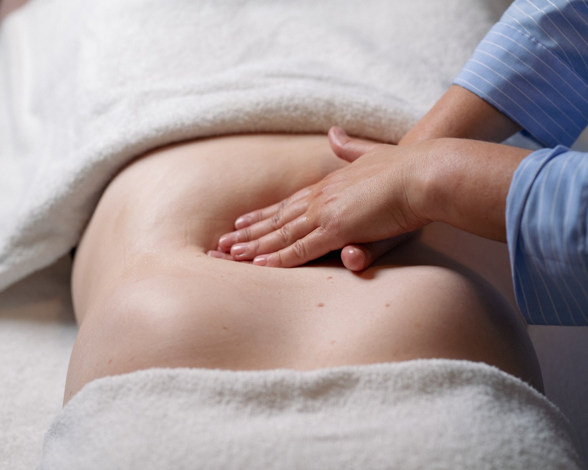 an abstract photo of a curved building with a blue sky in the background