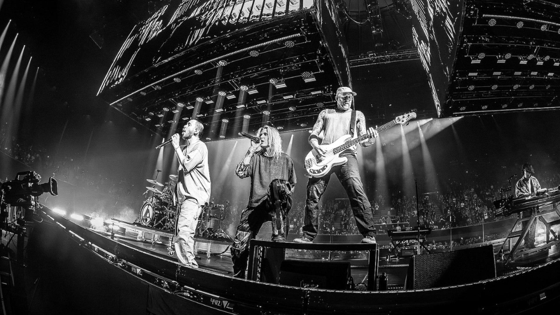an abstract photo of a curved building with a blue sky in the background