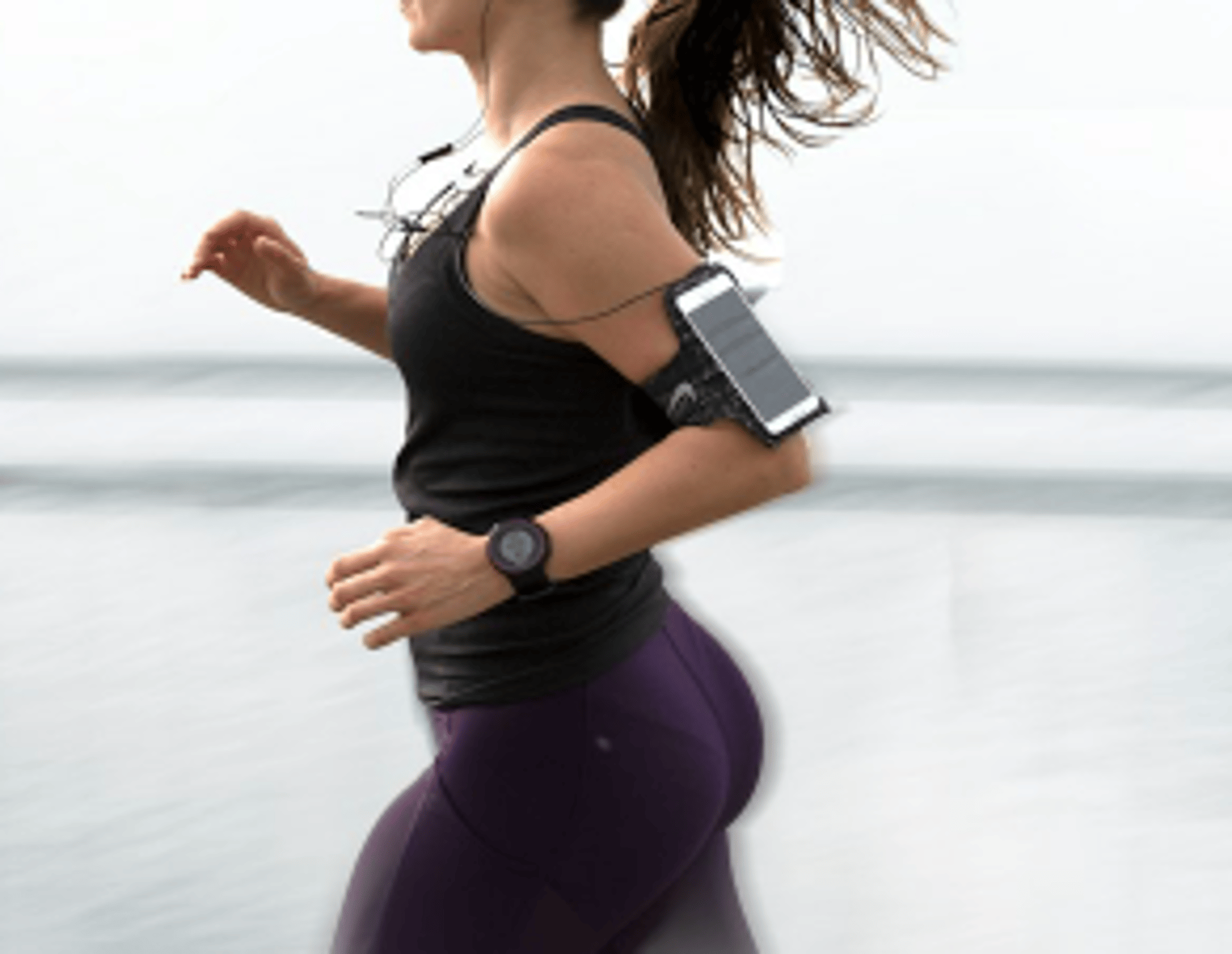 woman running wearing armband