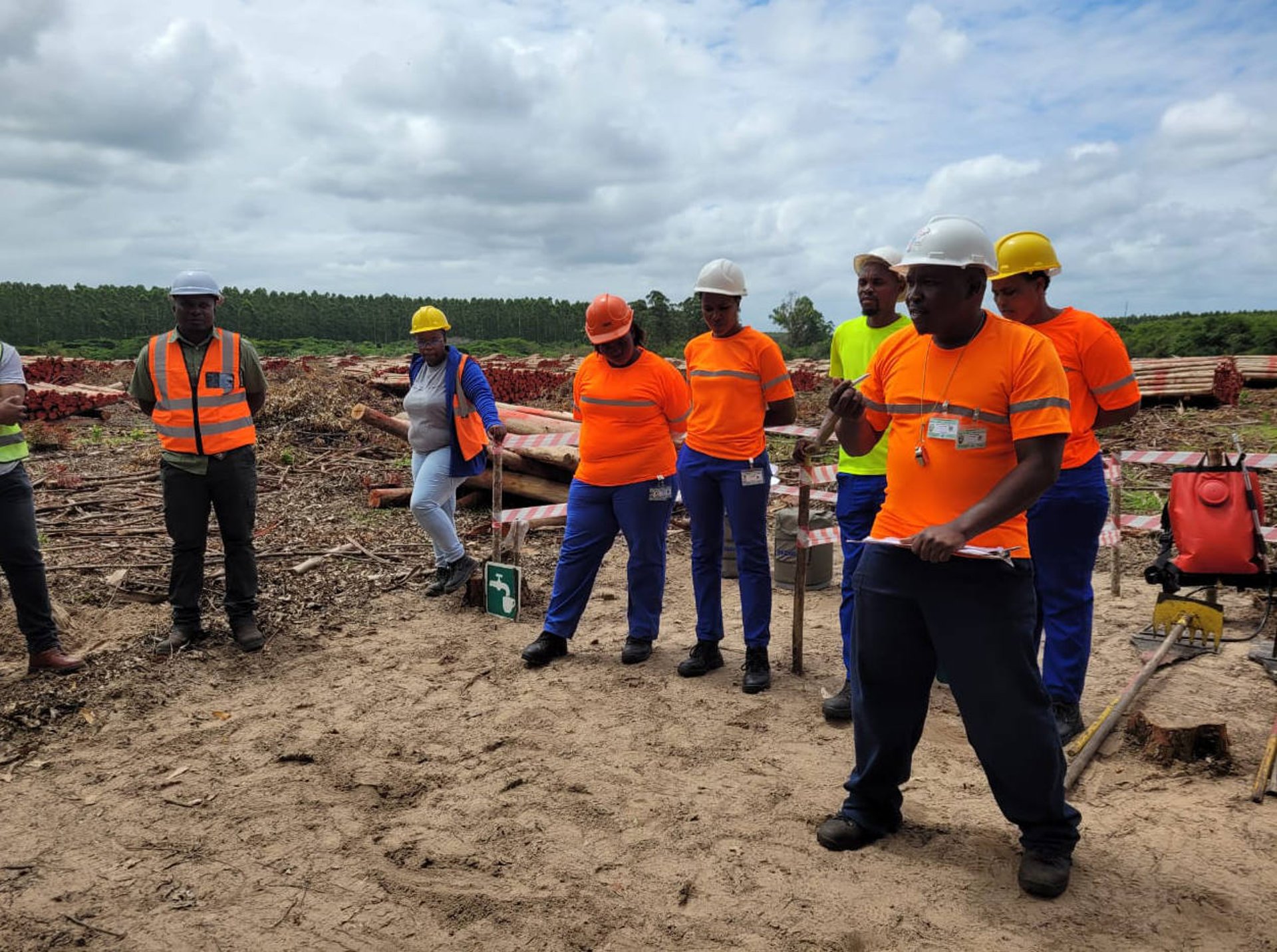 person in blue gloves holding white textile