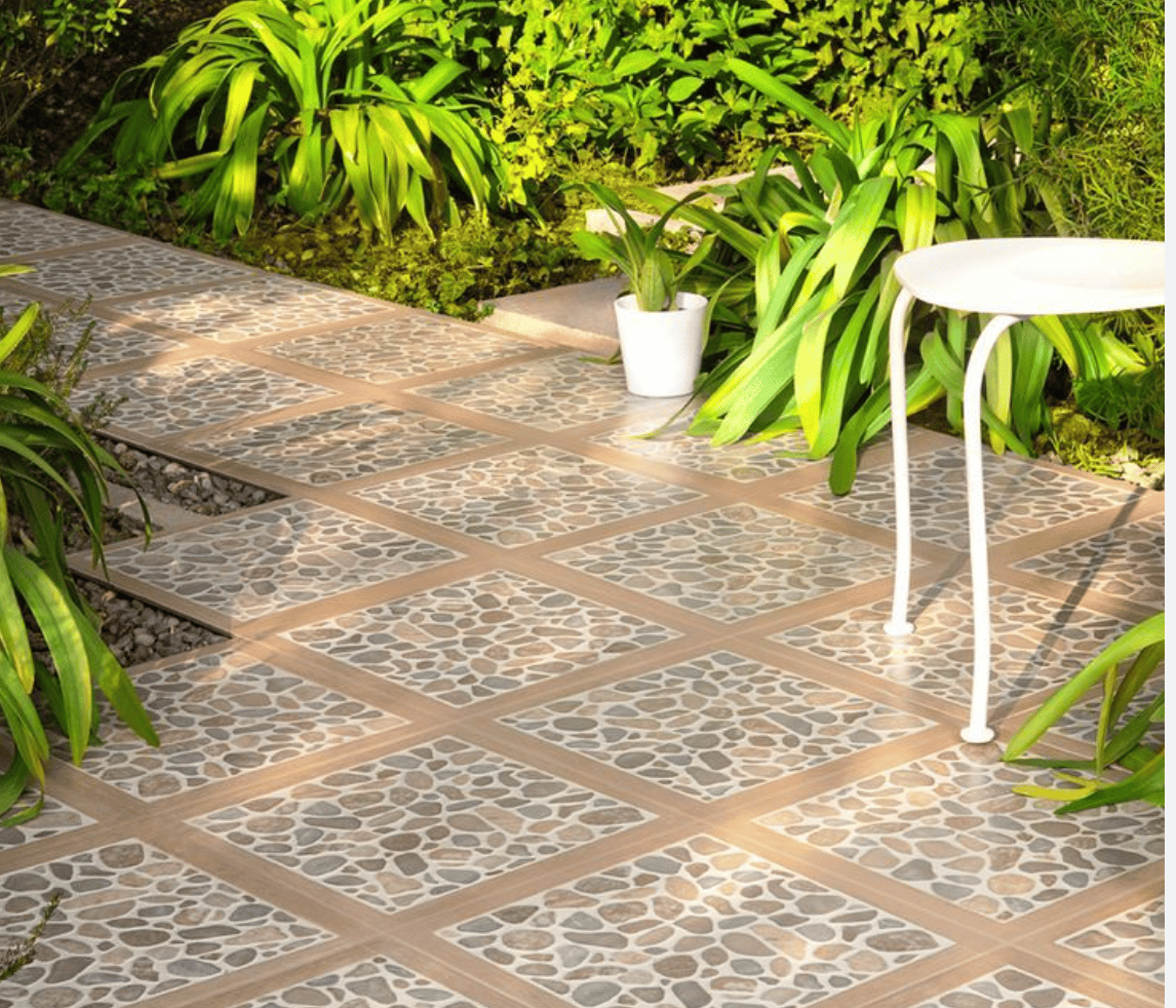 a patio with a table and chairs in front of a brick building