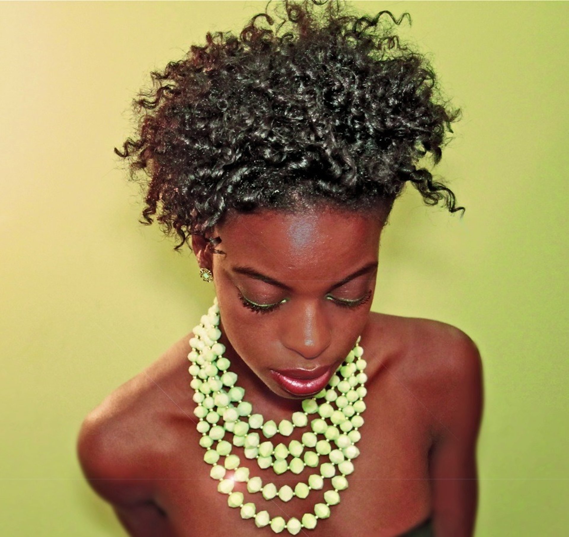 an abstract photo of a curved building with a blue sky in the background