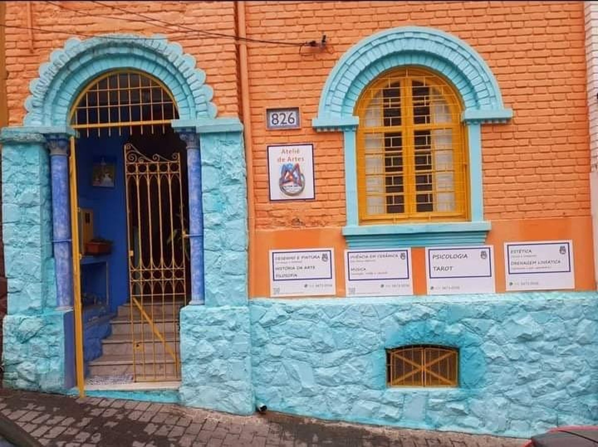 an abstract photo of a curved building with a blue sky in the background