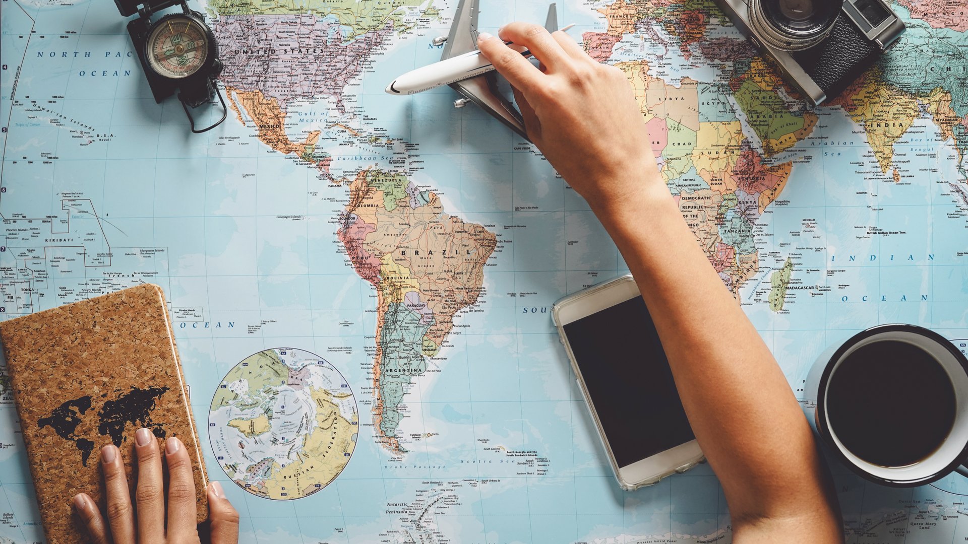 the sun is setting over a mountain range