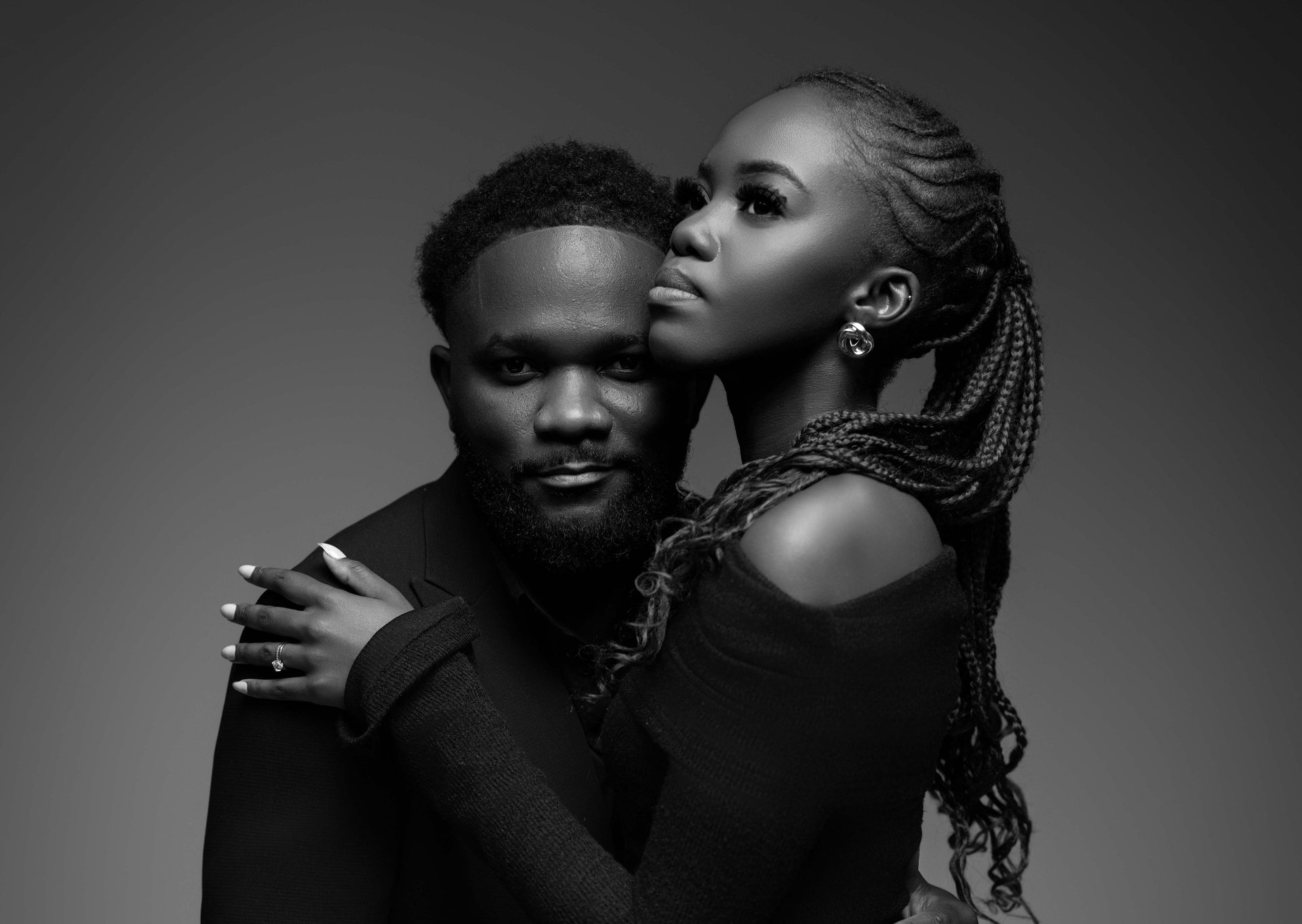 an abstract photo of a curved building with a blue sky in the background
