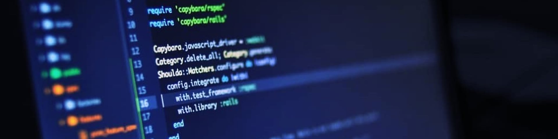an abstract photo of a curved building with a blue sky in the background
