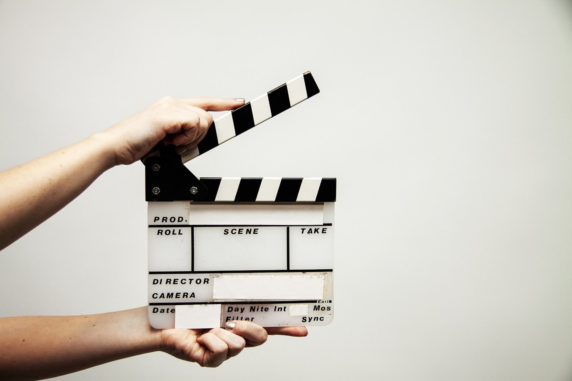 a person holding a clapper board