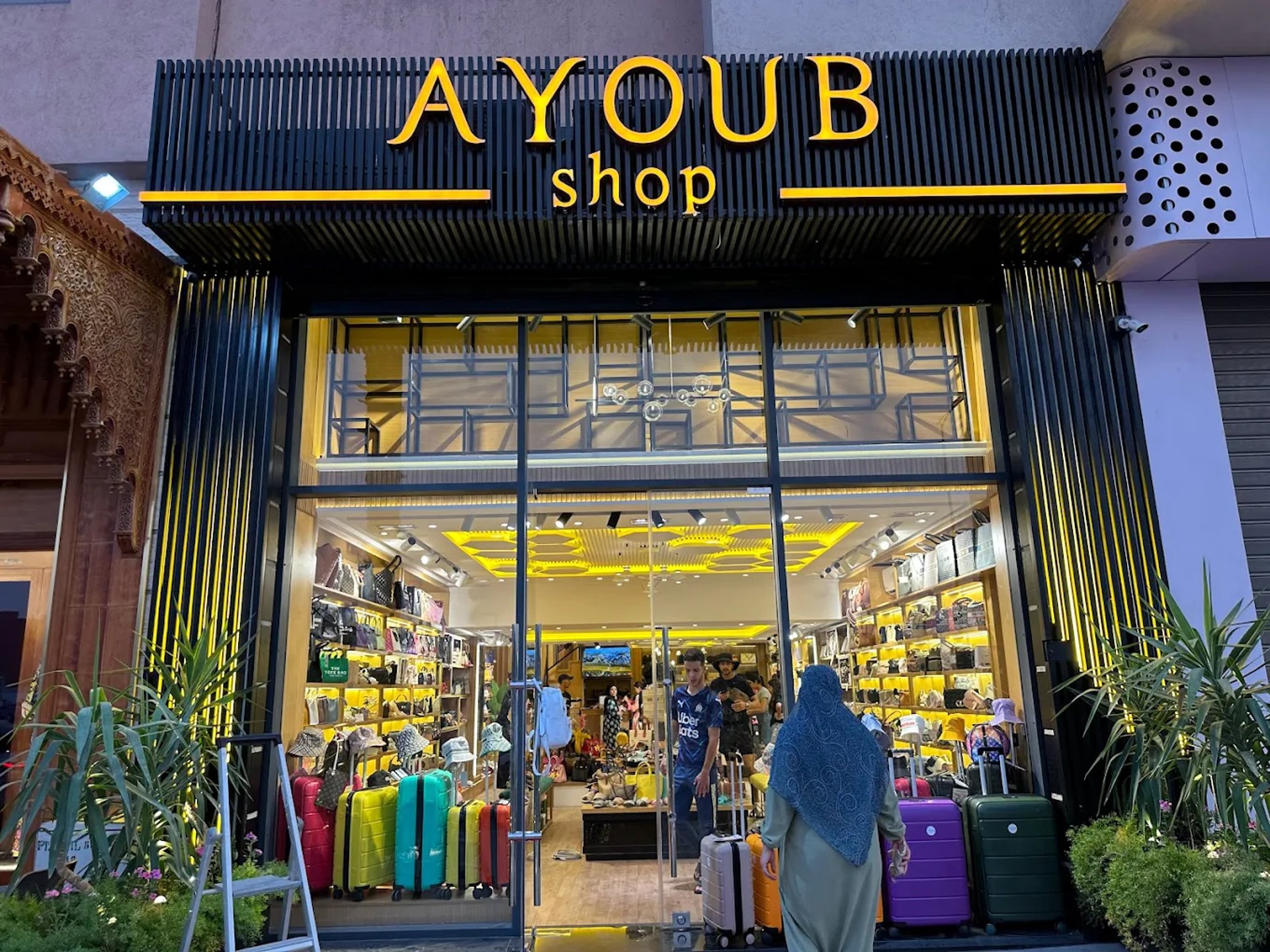woman wearing yellow long-sleeved dress under white clouds and blue sky during daytime