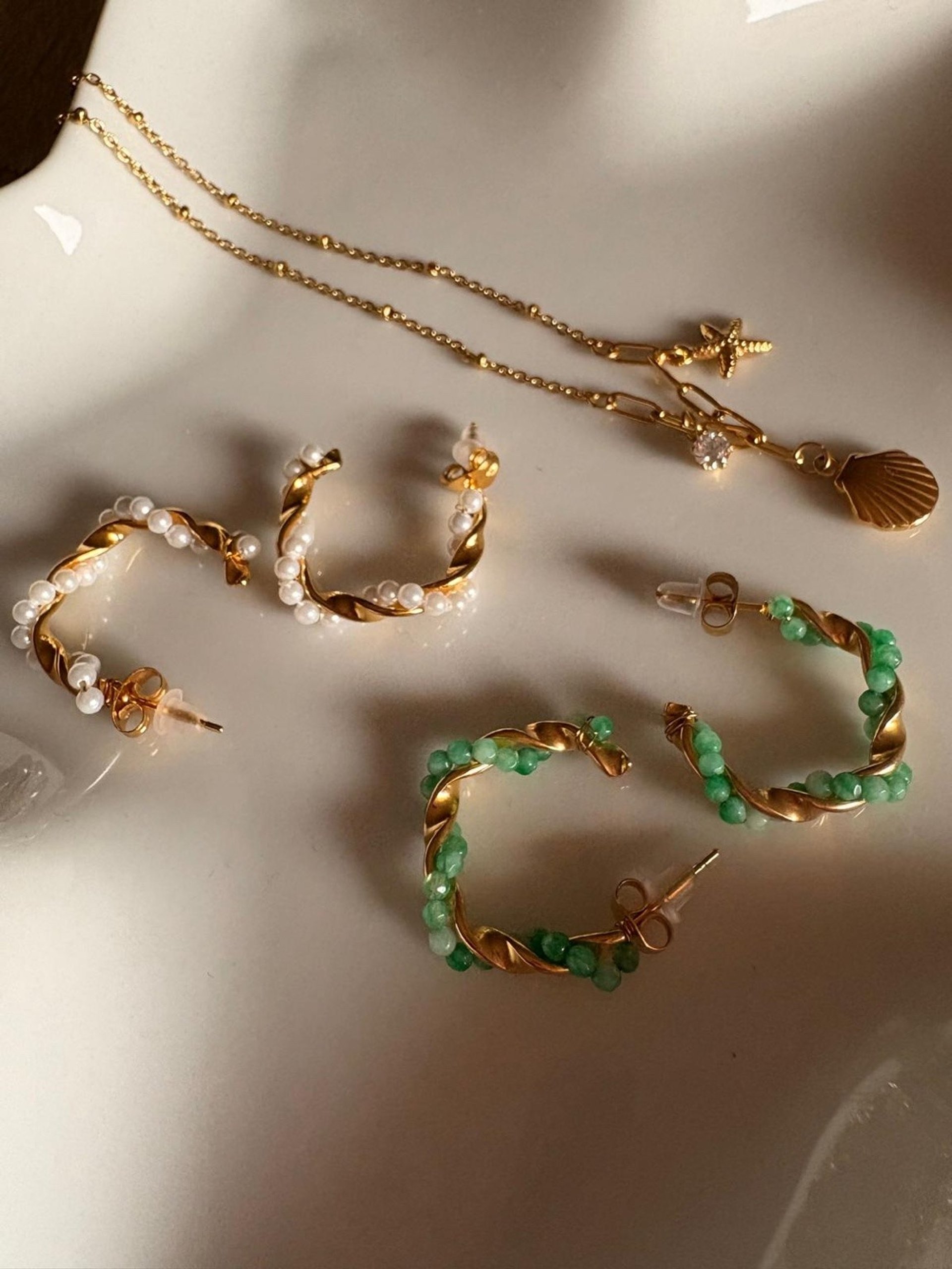 person wearing grey knit sweater