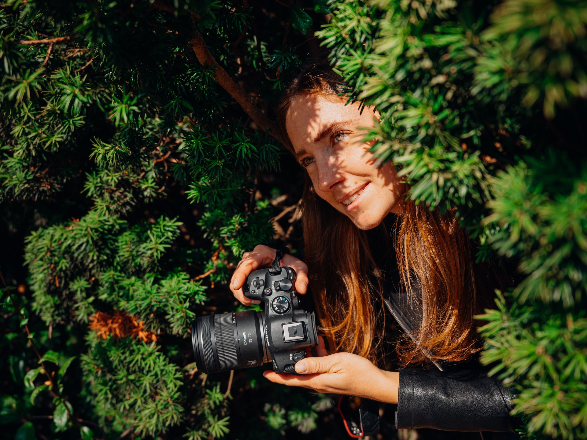 a person is walking in the desert at sunset