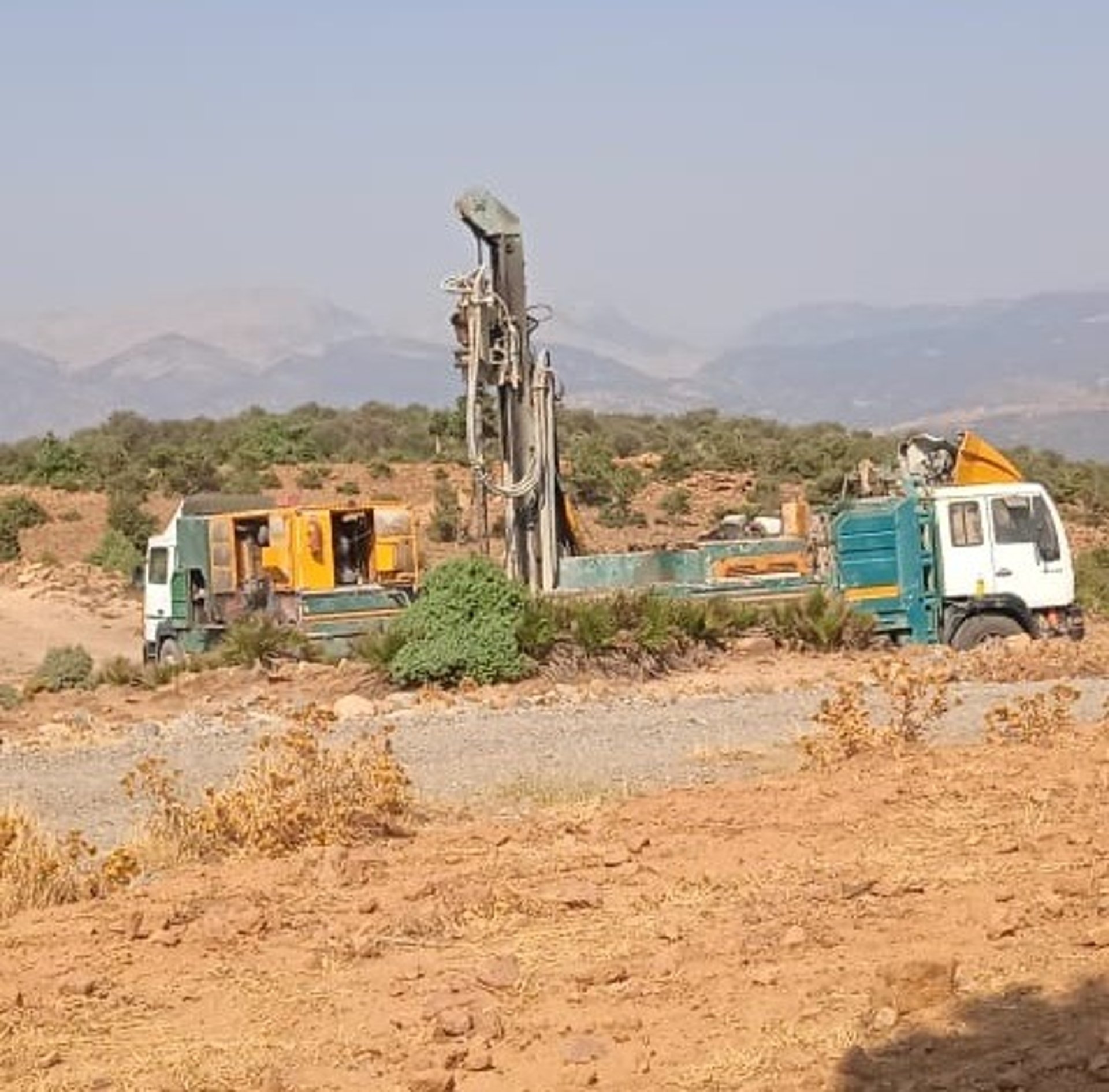 white van on road near mountain during daytime