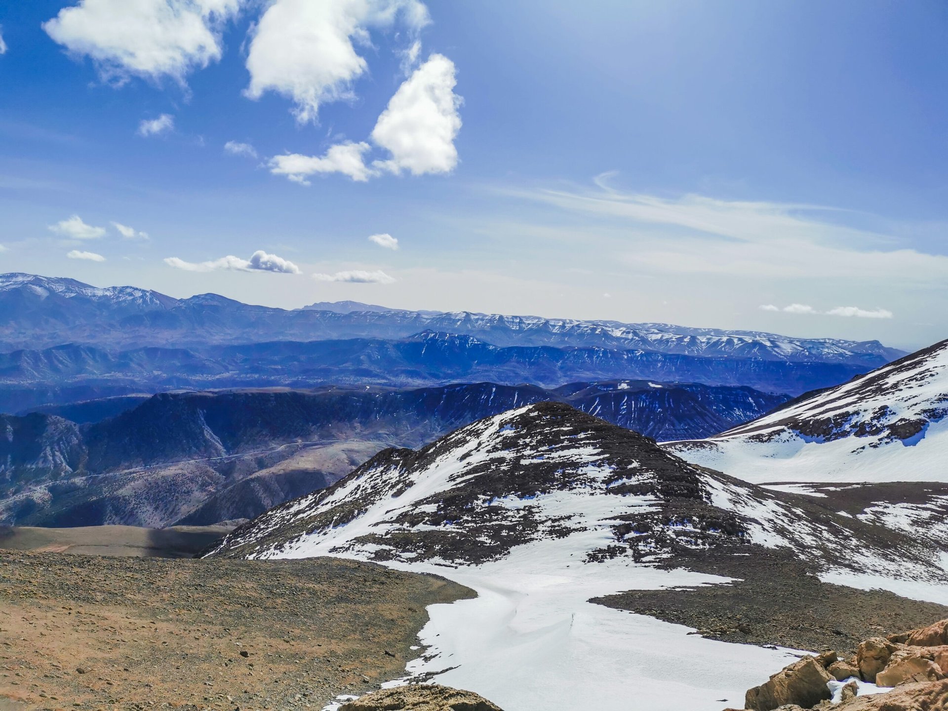 white van on road near mountain during daytime