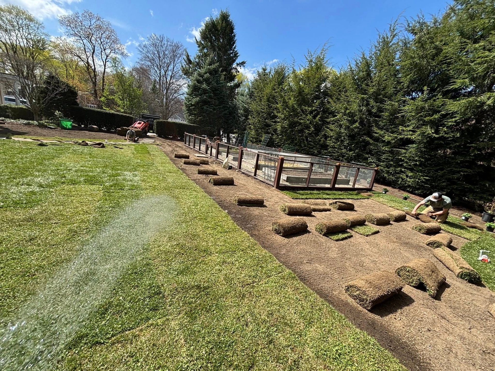 sod-being-laid-out-by-capstone-landscape-services-employees.jpg