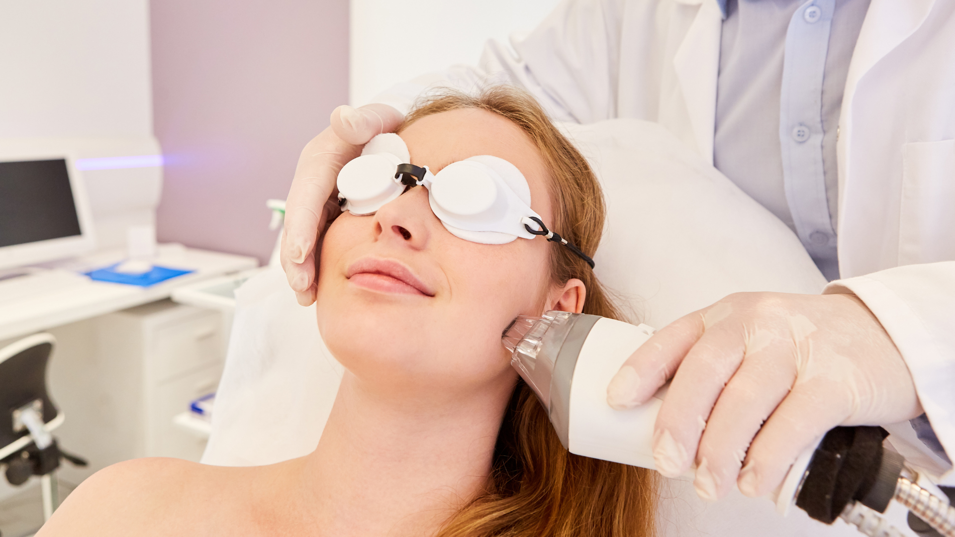 woman getting fraxel laser treatment on cheek