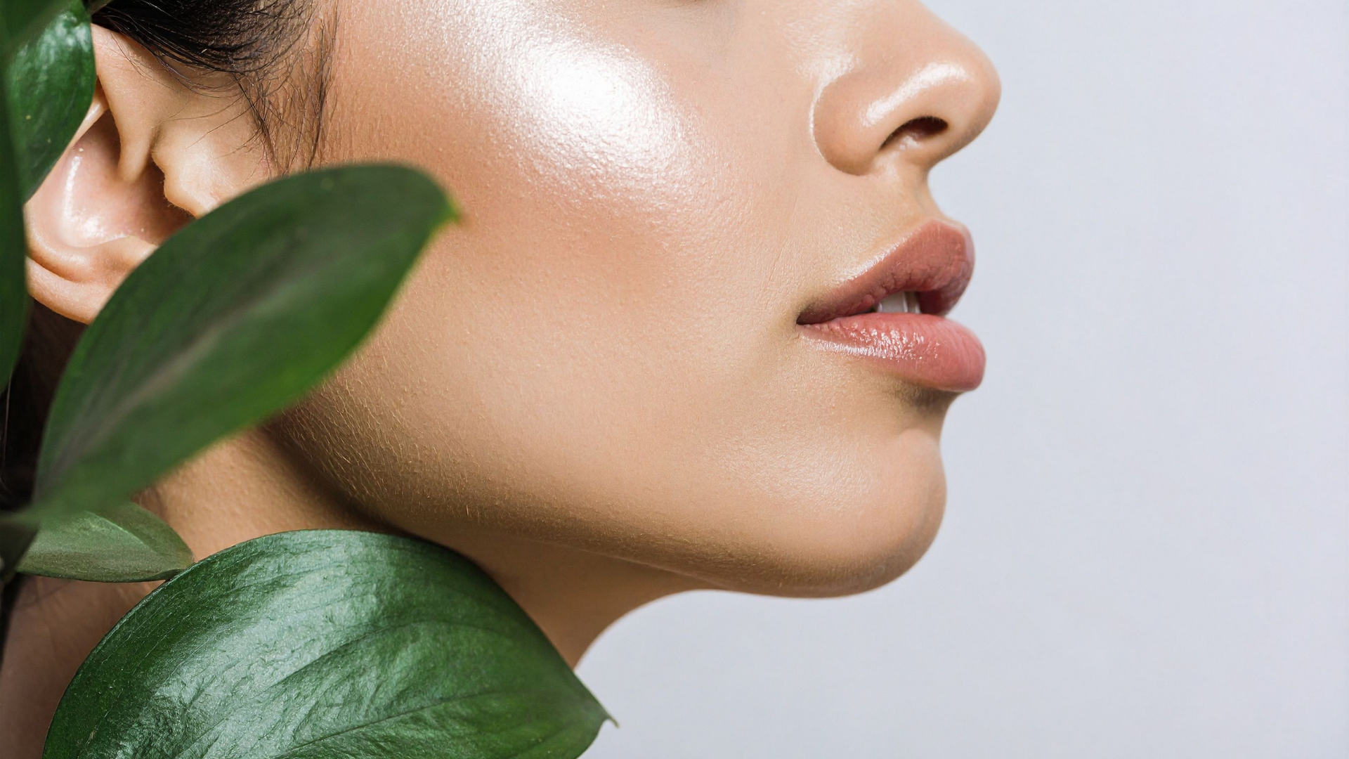woman getting fraxel laser treatment on cheek