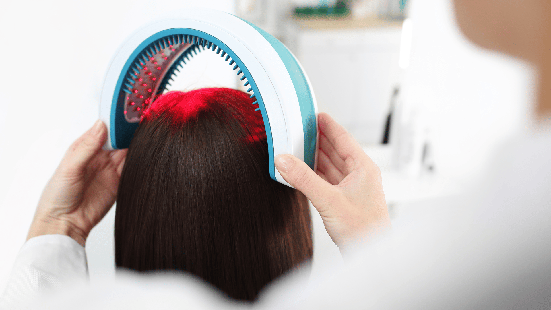 low level light therapy on woman's head to treat hair loss