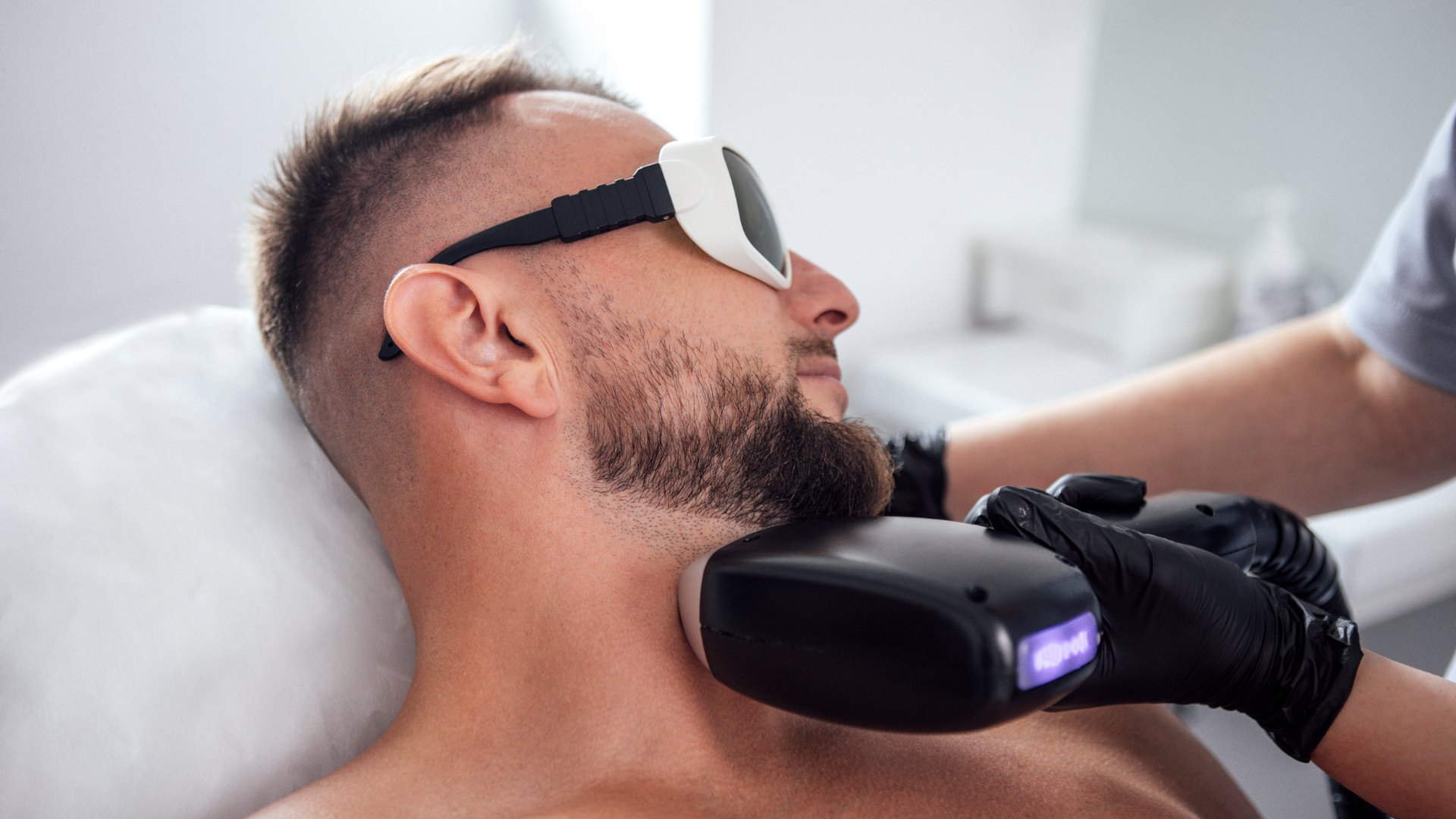 man getting laser hair removal on beard/under chin