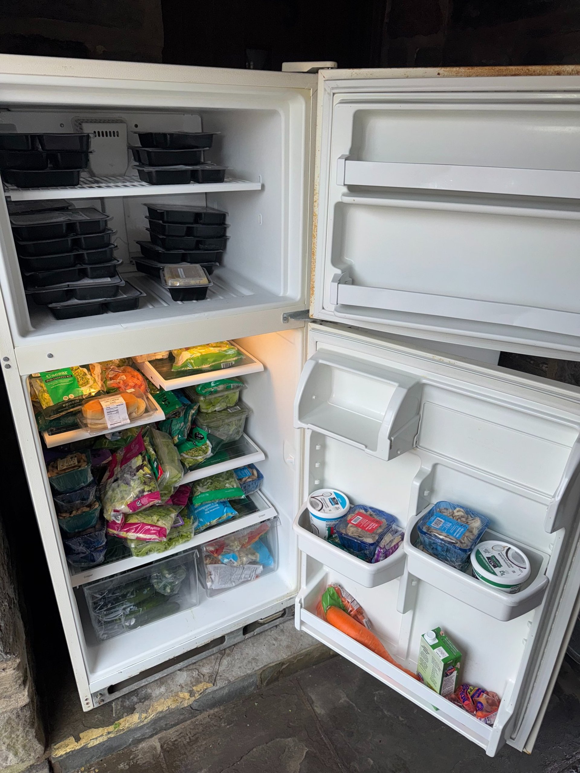 an open refrigerator filled with lots of food