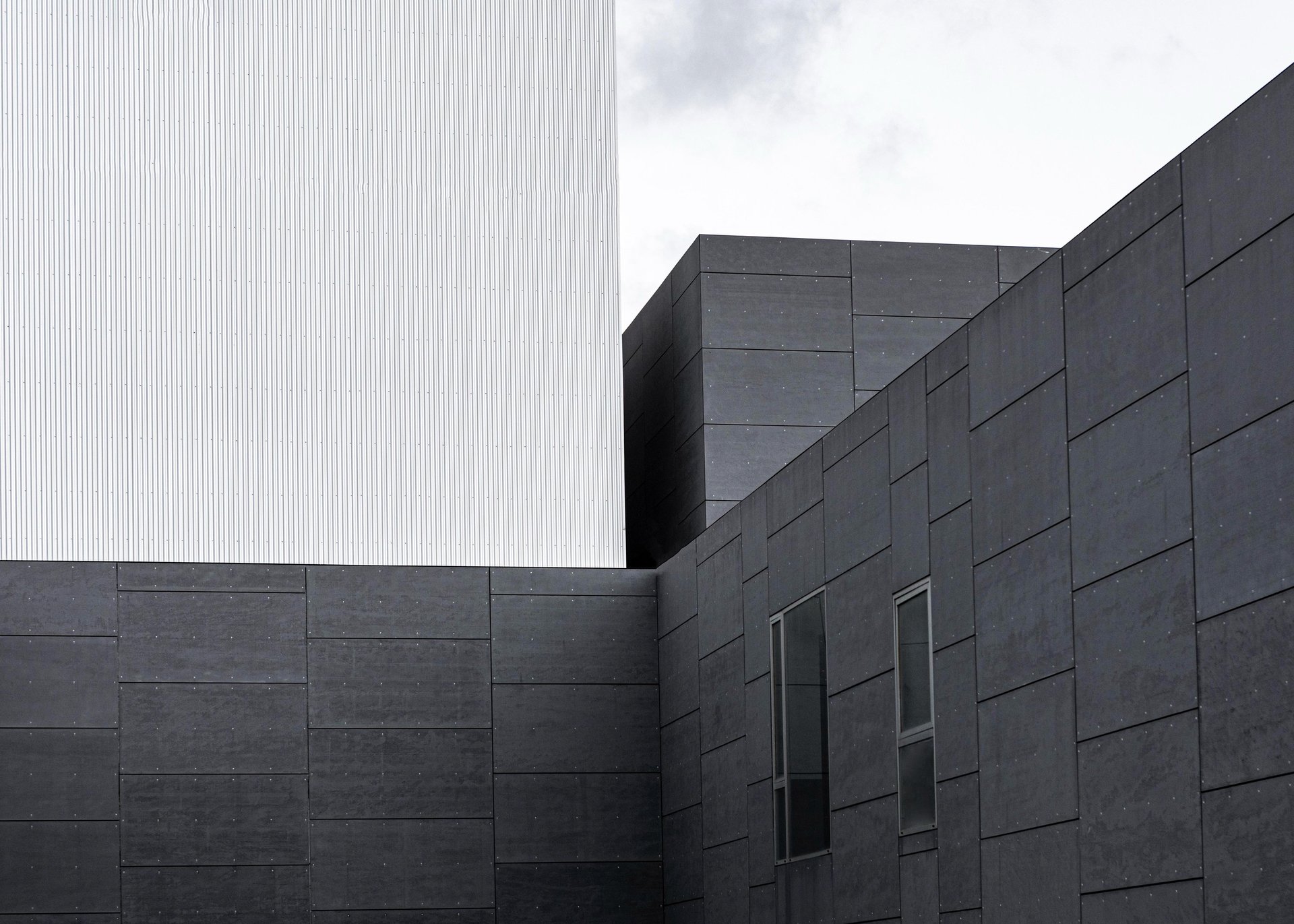 black and brown leather padded tub sofa