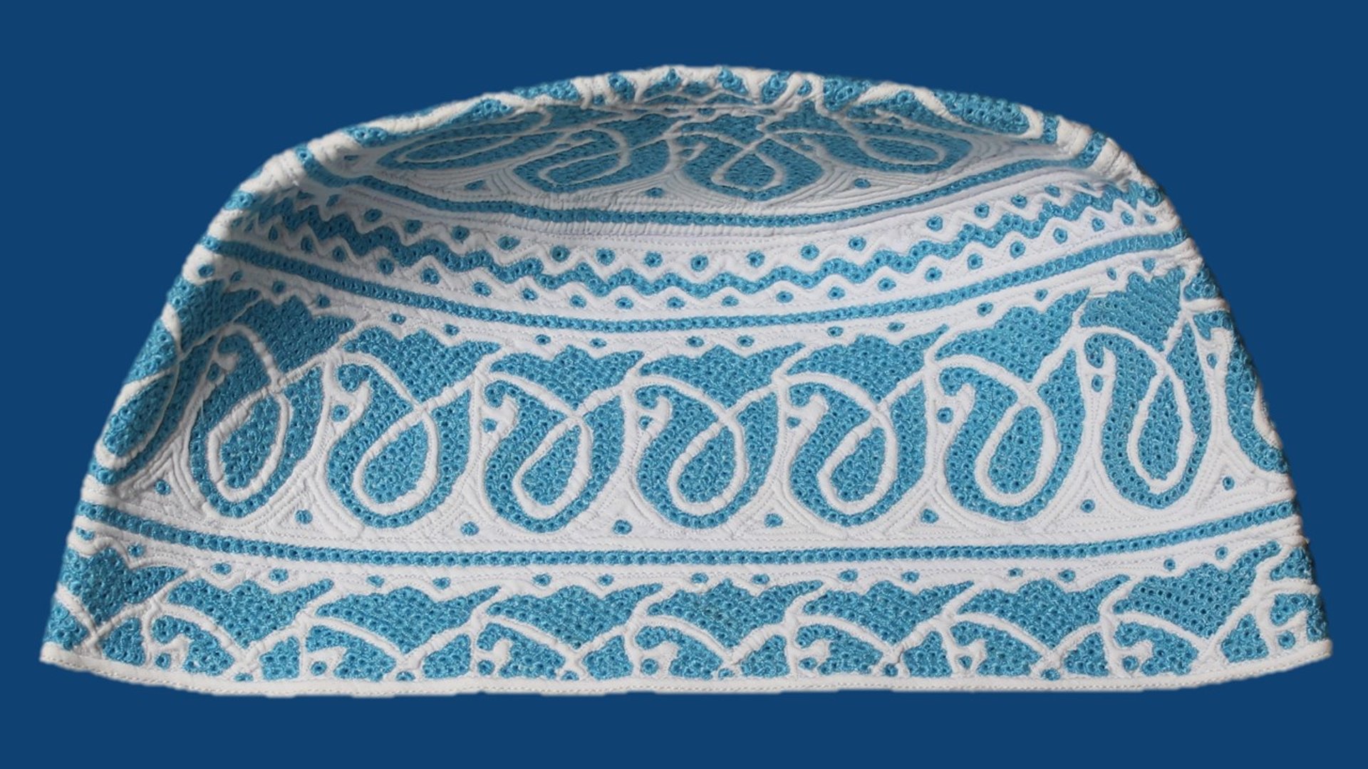 an abstract photo of a curved building with a blue sky in the background