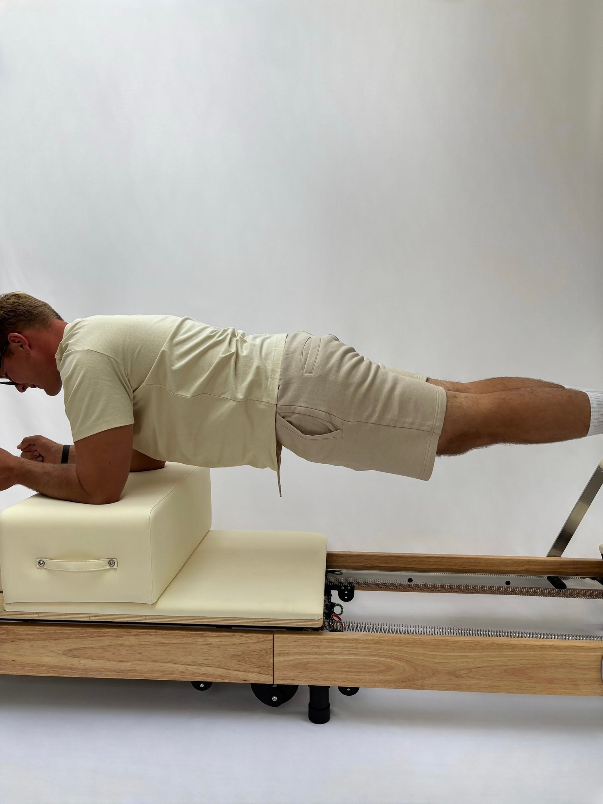 a woman is doing a plank exercise in a gym