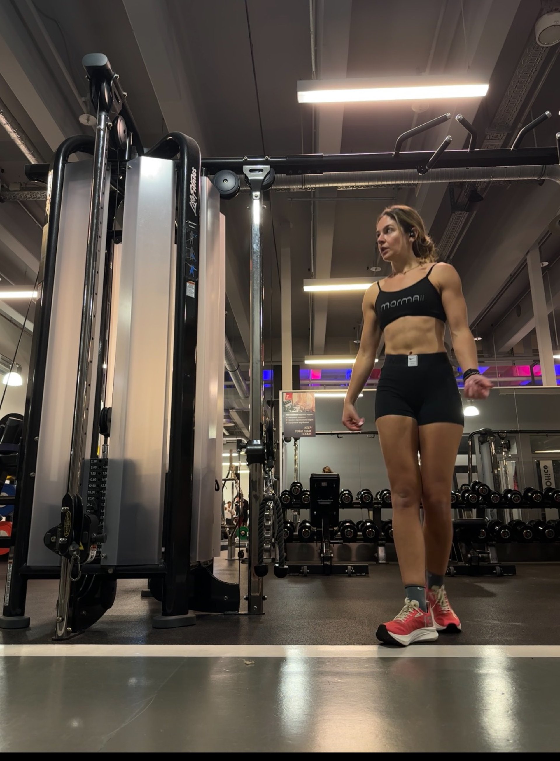an abstract photo of a curved building with a blue sky in the background