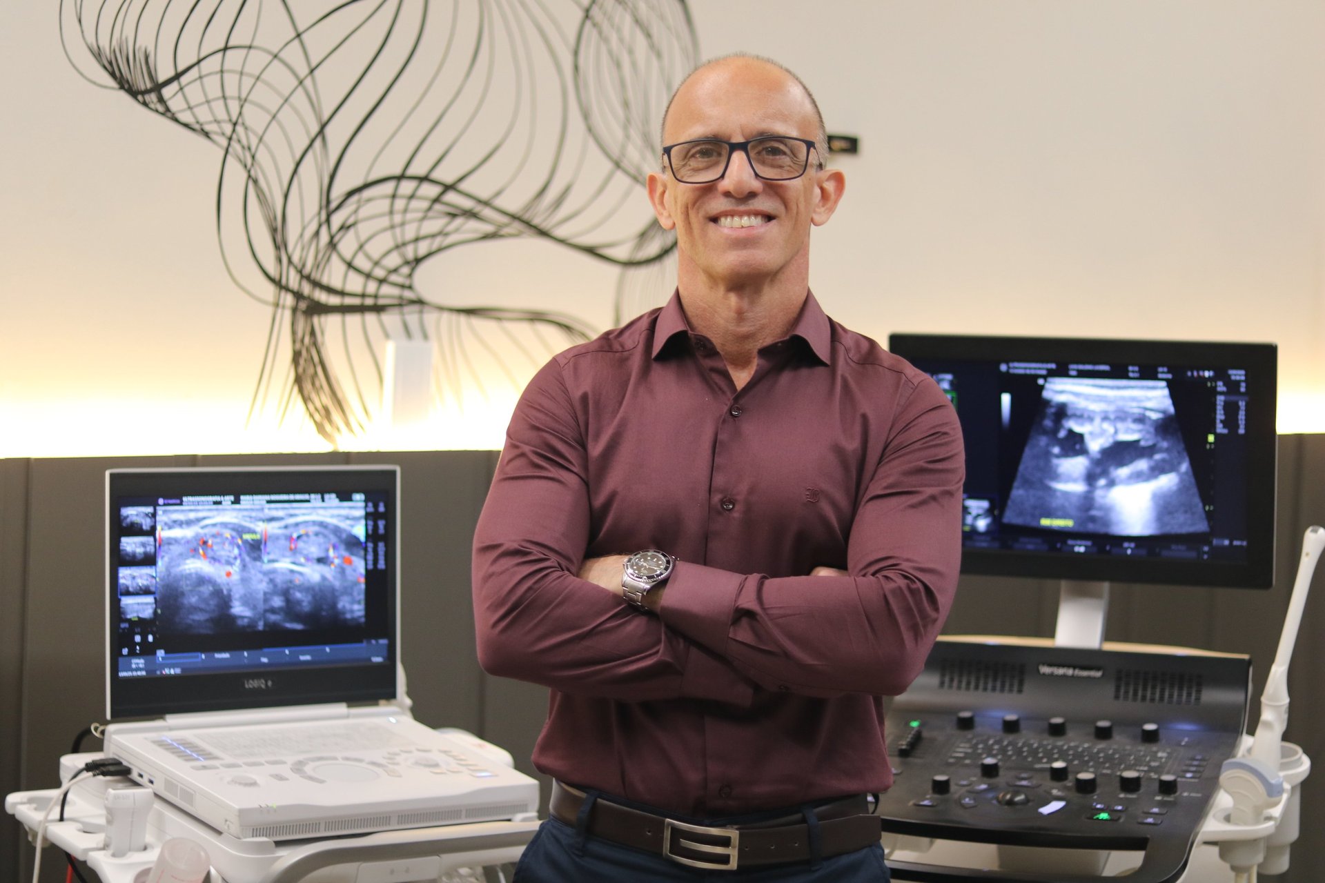 woman standing surrounded by exercise equipment