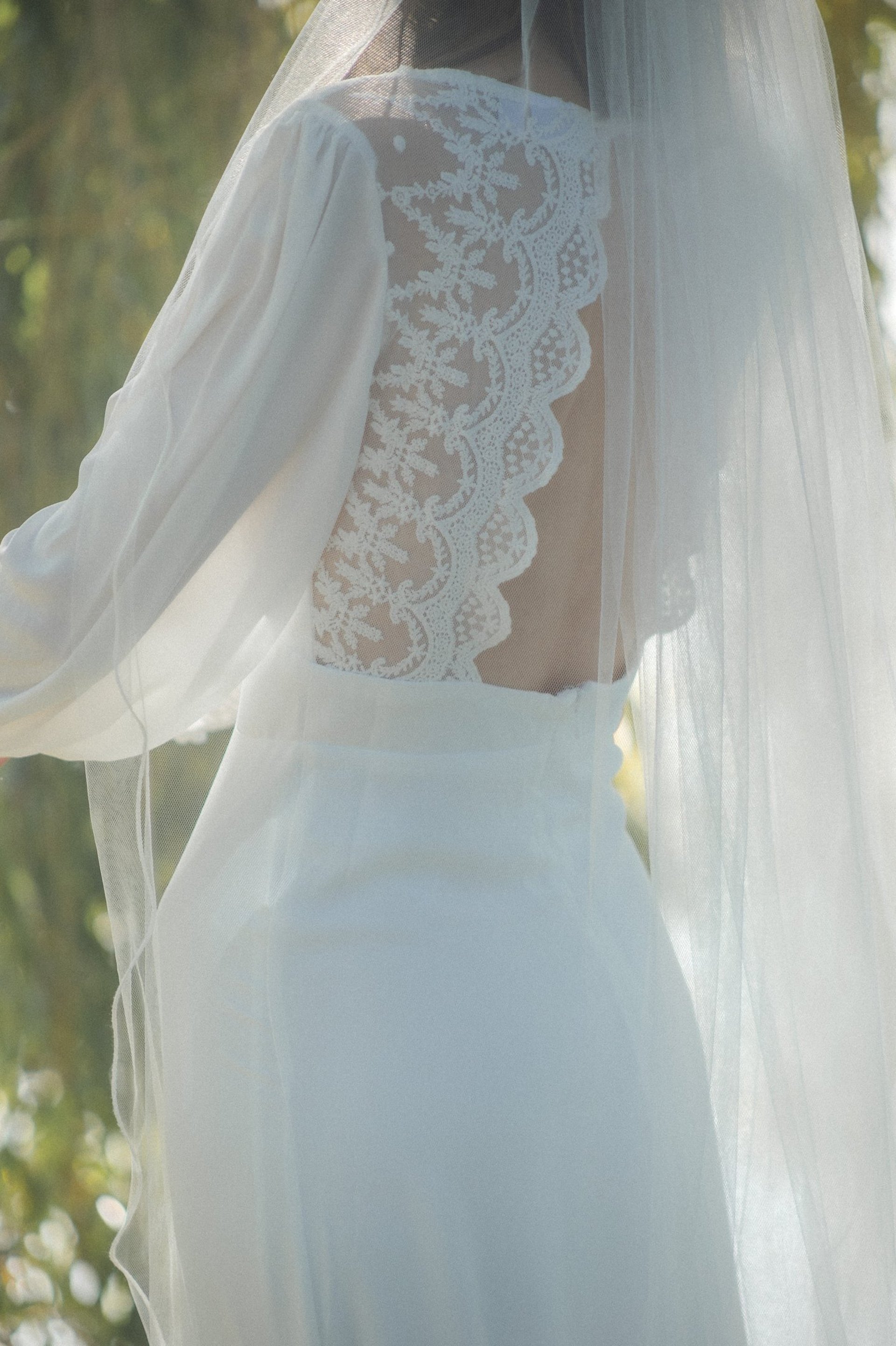 an abstract photo of a curved building with a blue sky in the background