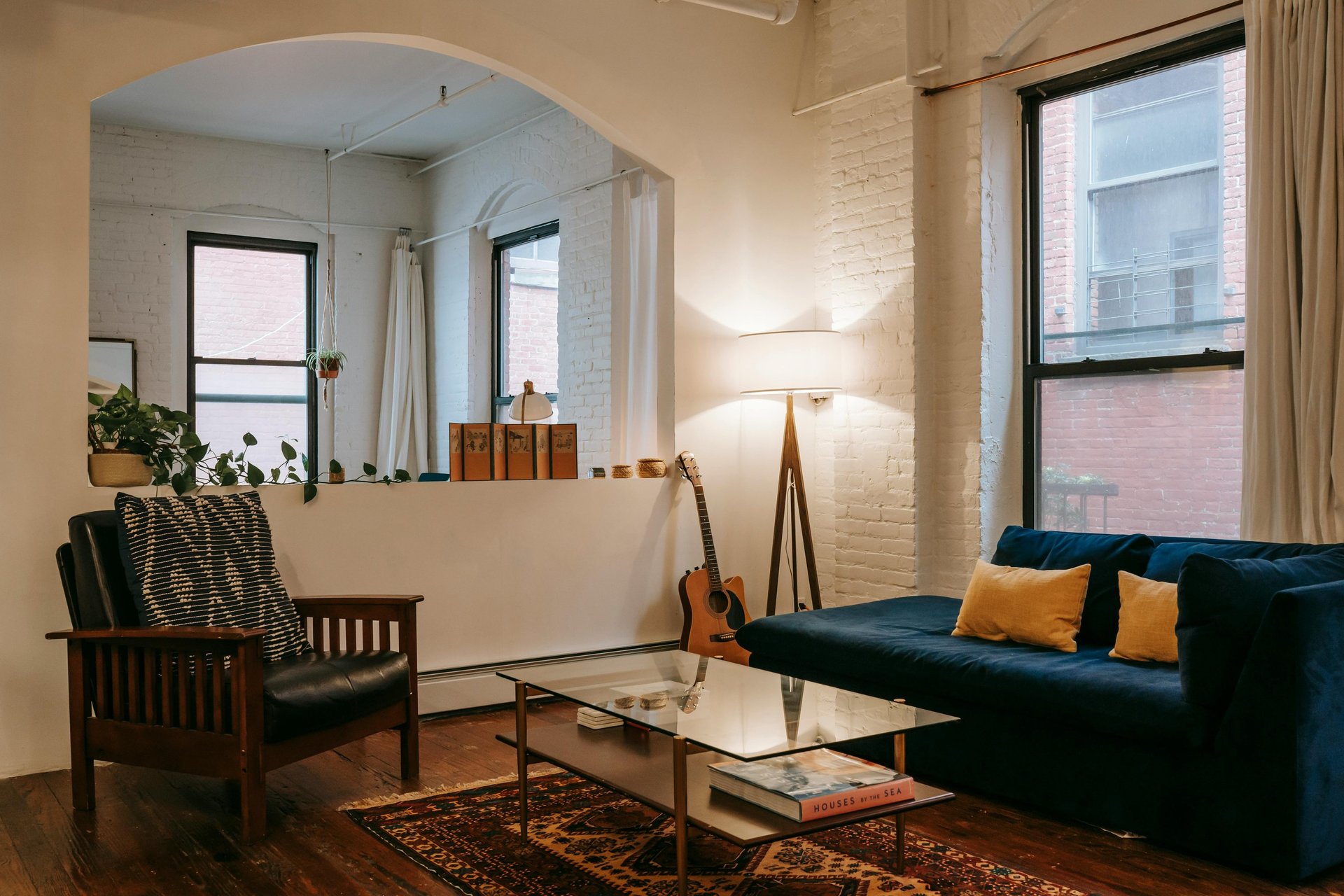 a living room filled with furniture and a flat screen tv