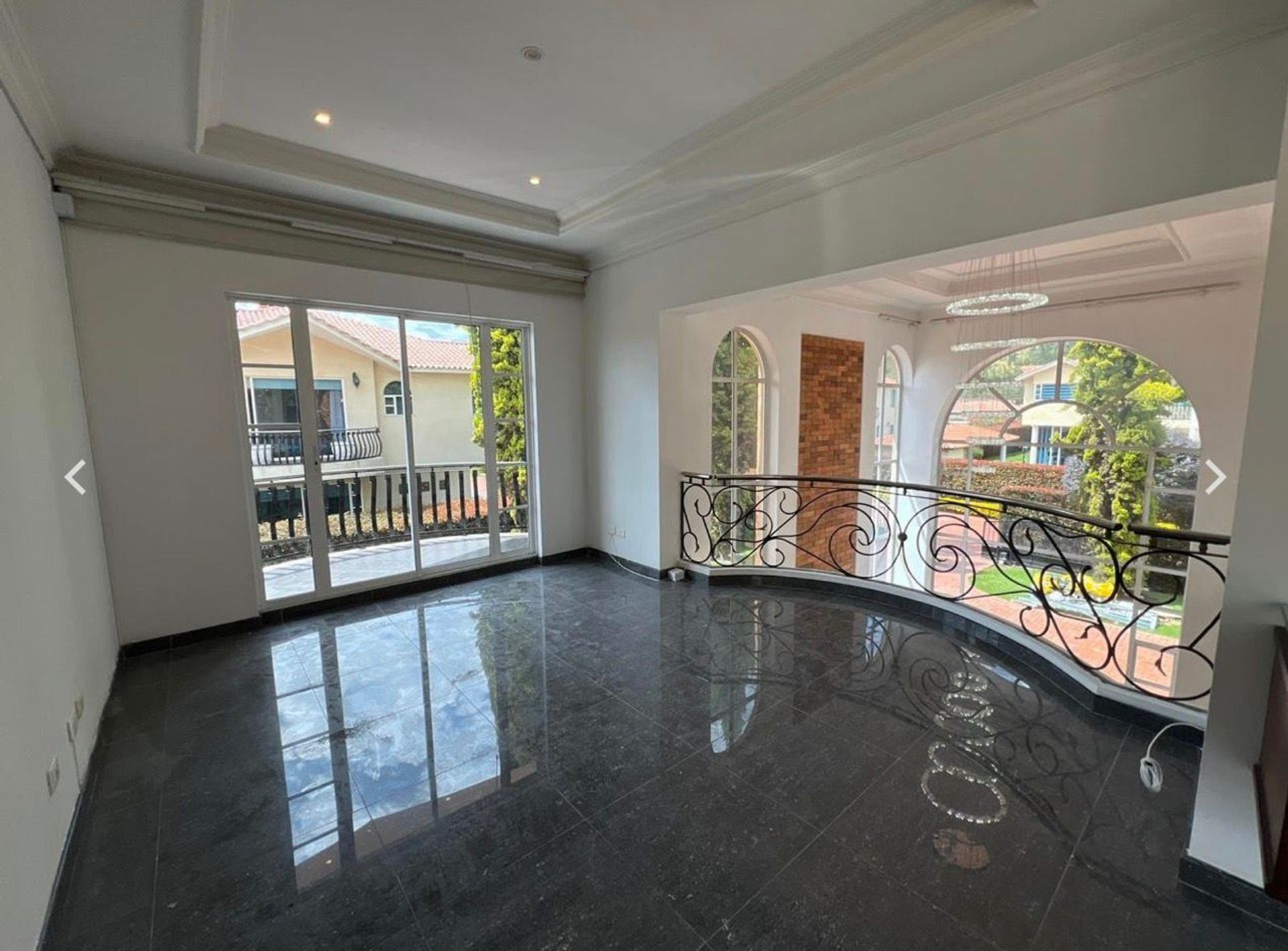 a living room with two chairs and a fire place