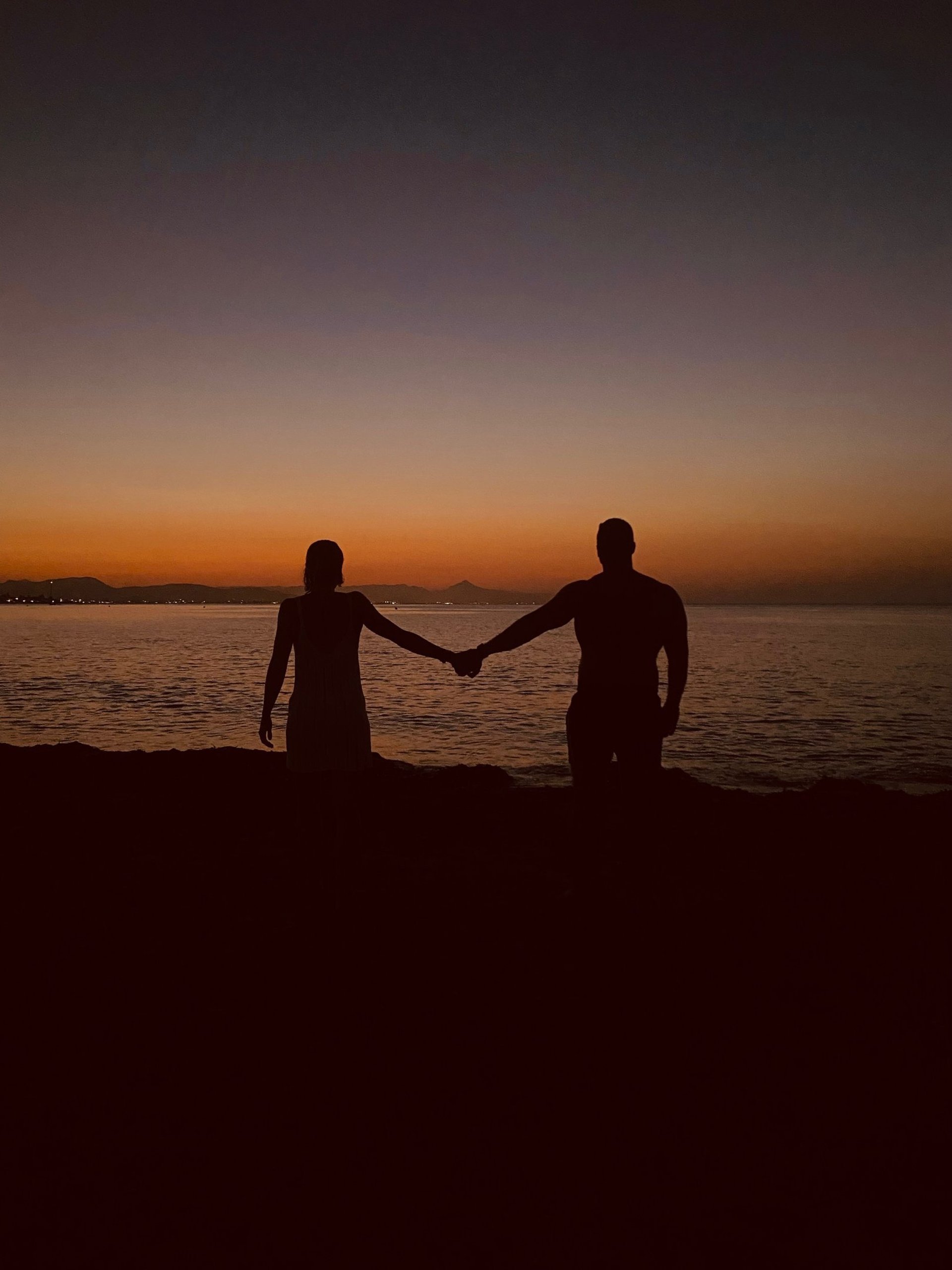 couple wearing silver-colored rings