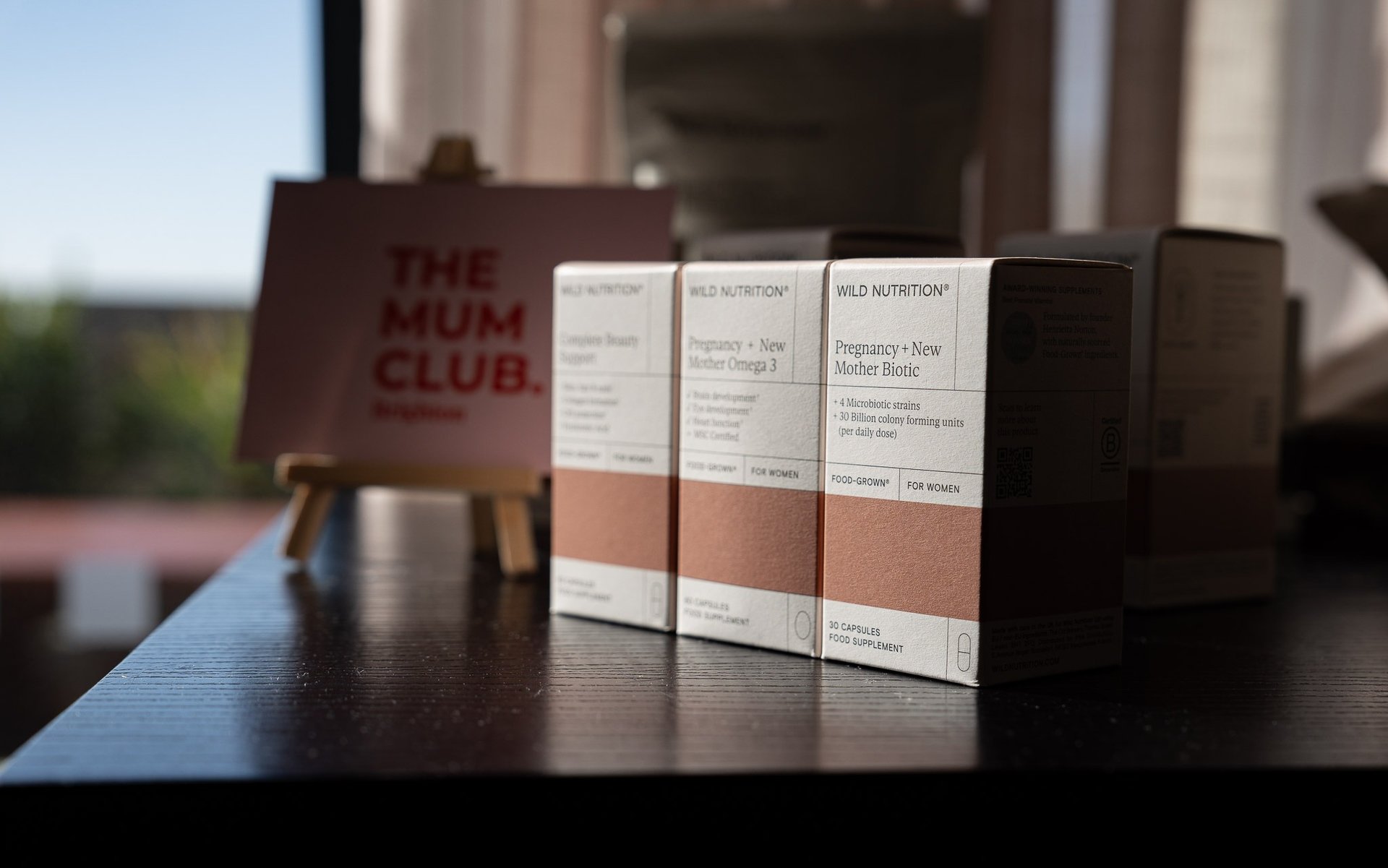 a bottle of perfume sitting on top of a table