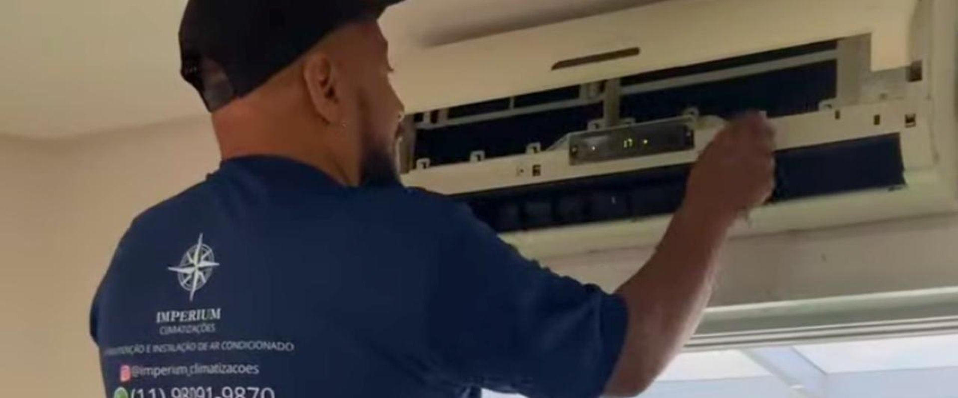 man wearing black jacket holding rod