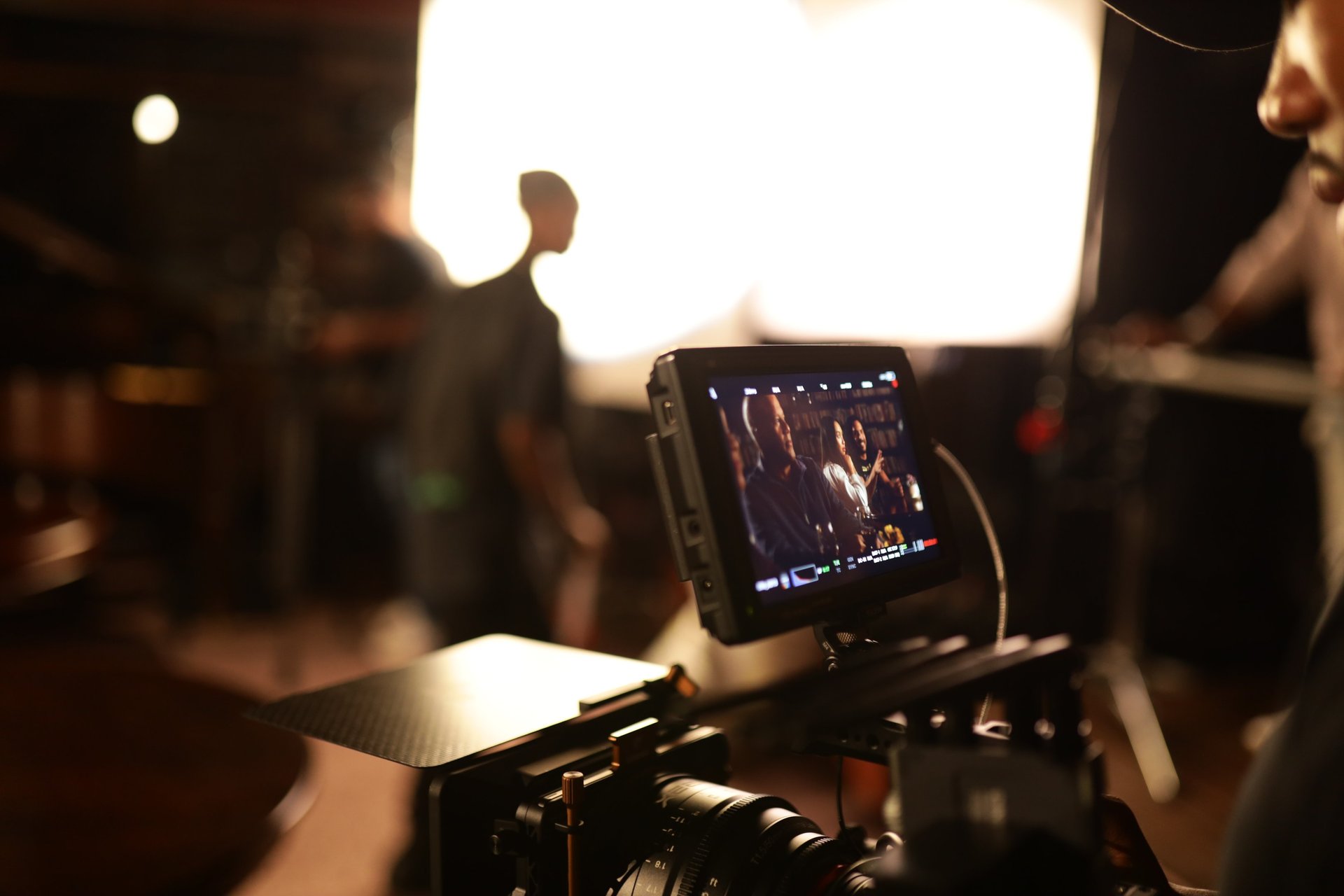 an abstract photo of a curved building with a blue sky in the background