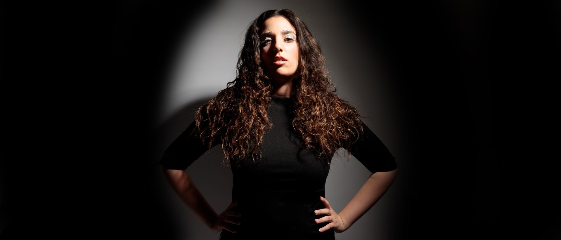 an abstract photo of a curved building with a blue sky in the background