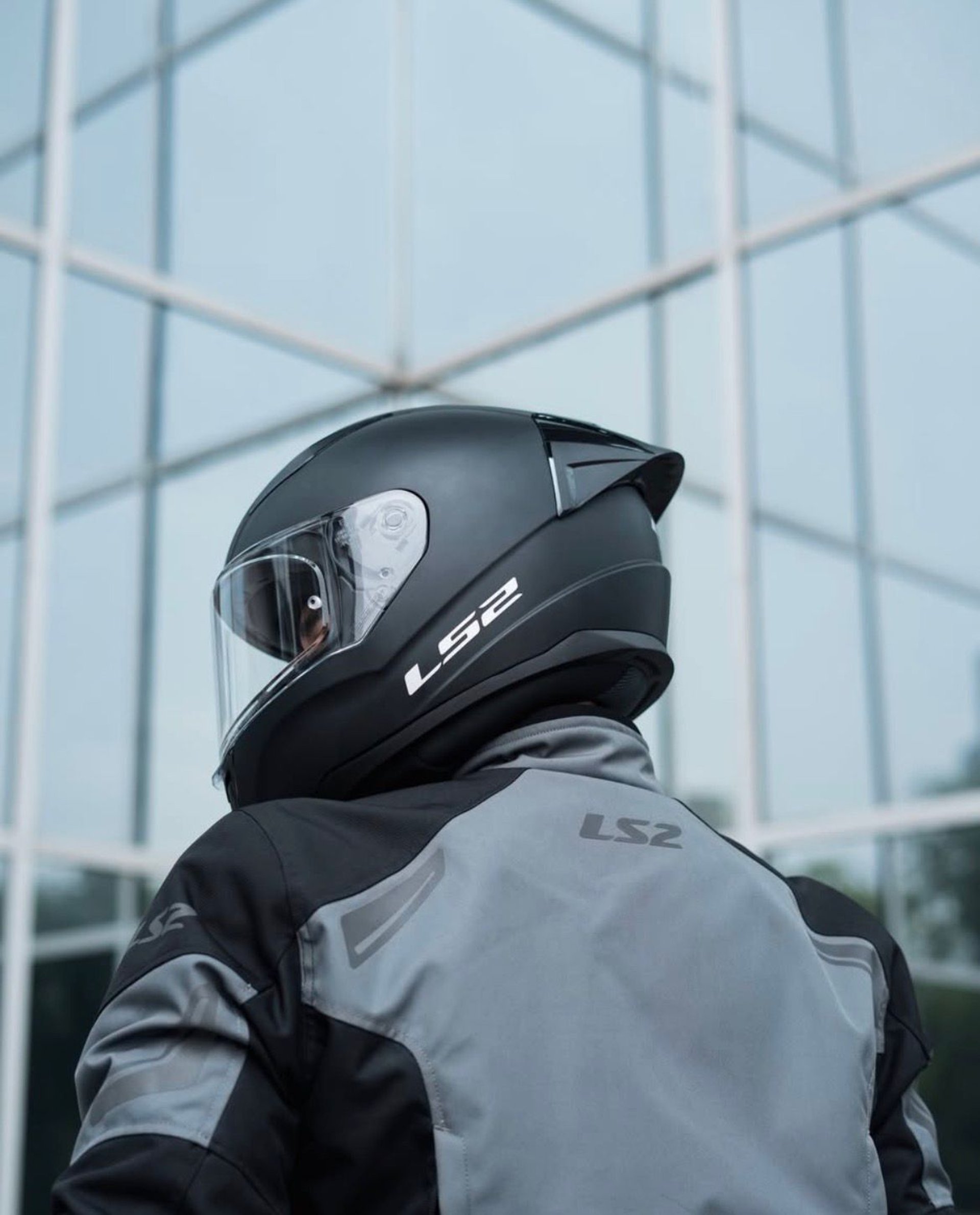 person wearing grey knit sweater