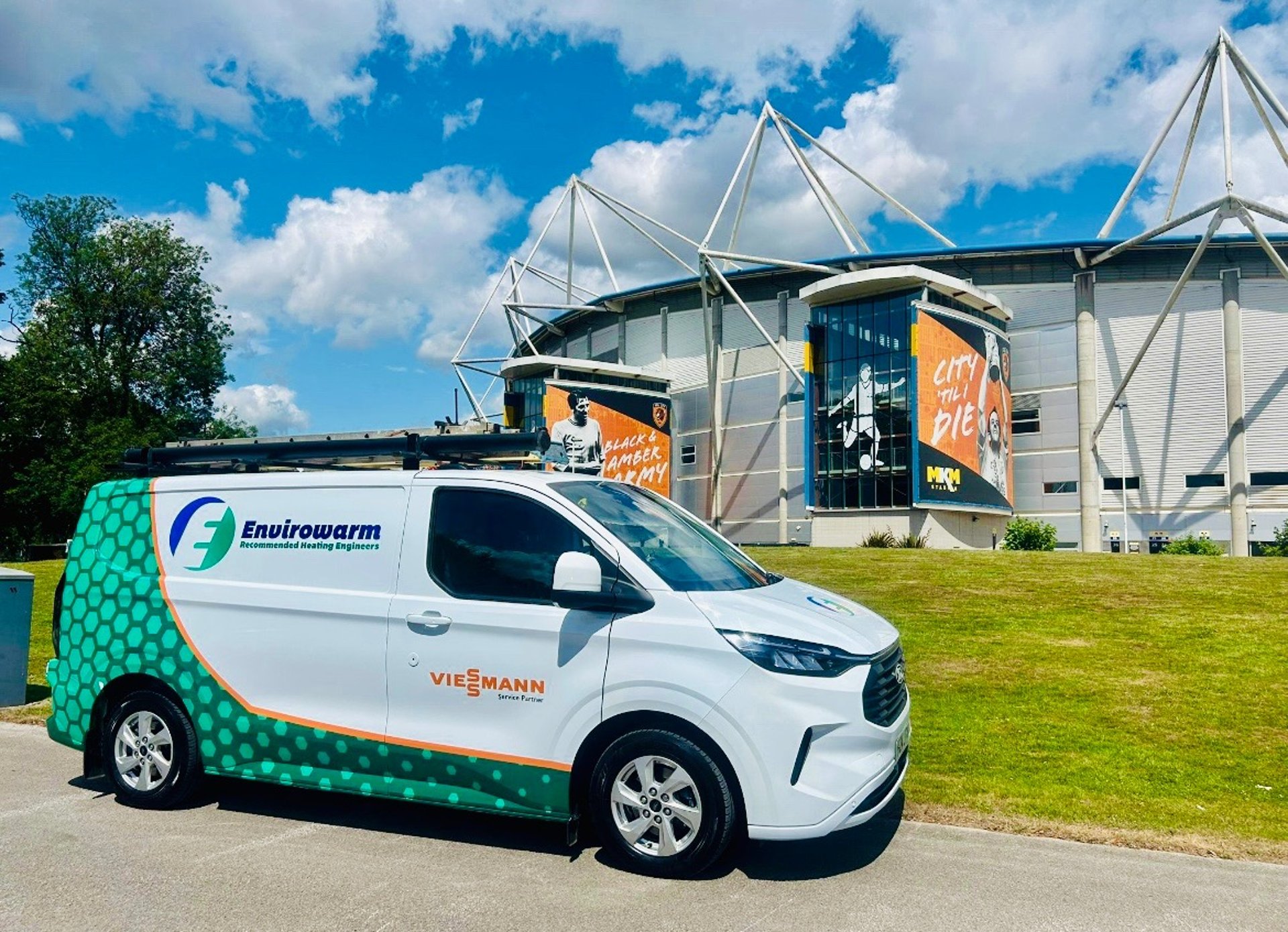 an abstract photo of a curved building with a blue sky in the background