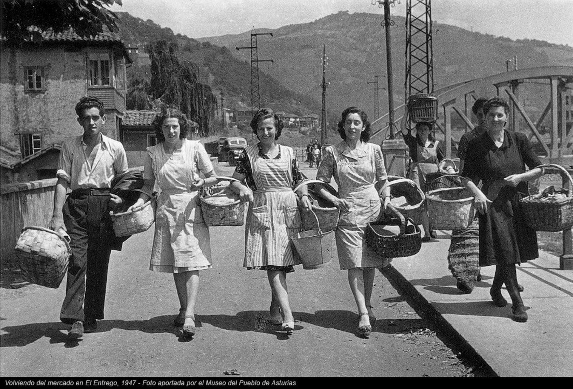 an abstract photo of a curved building with a blue sky in the background