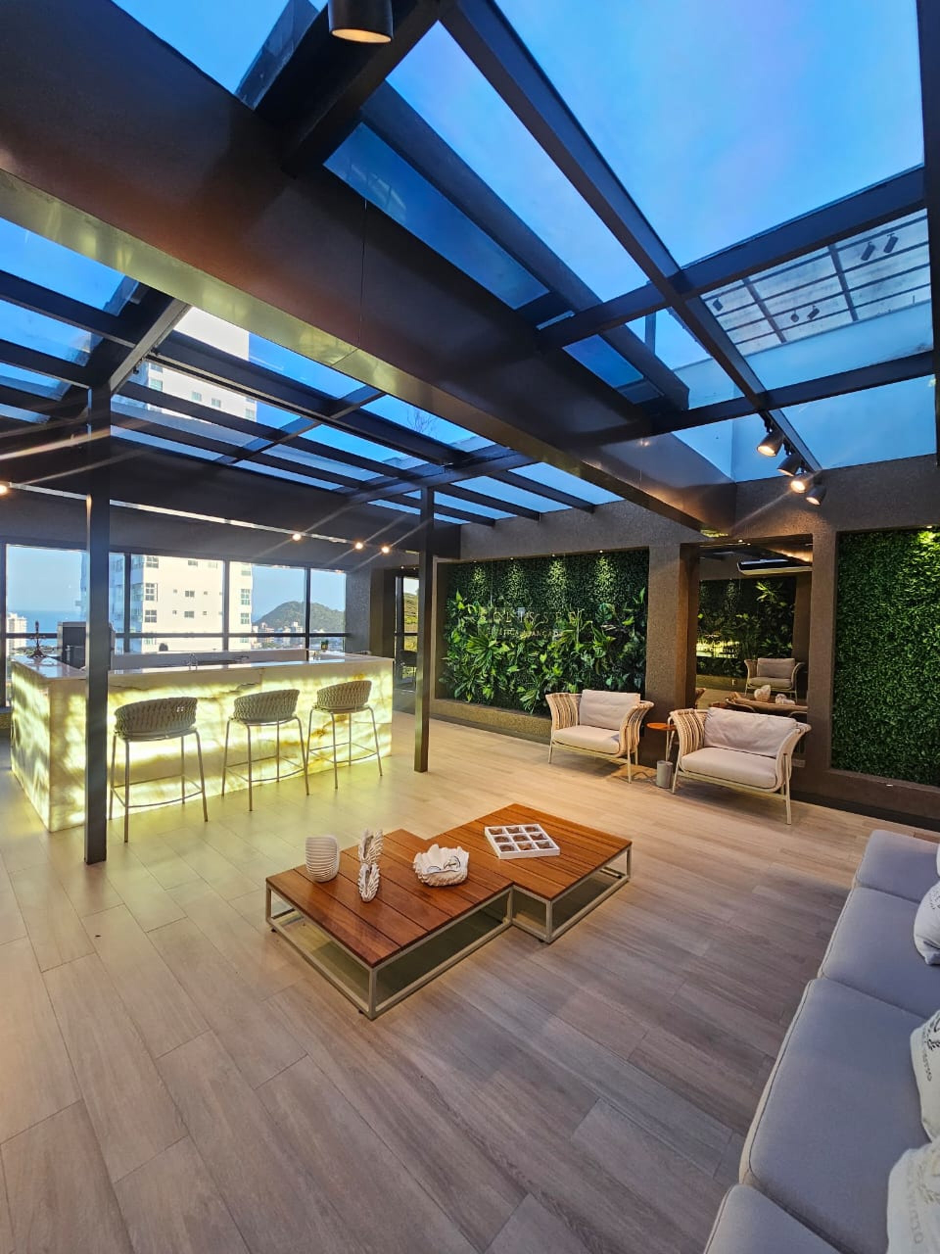 an abstract photo of a curved building with a blue sky in the background