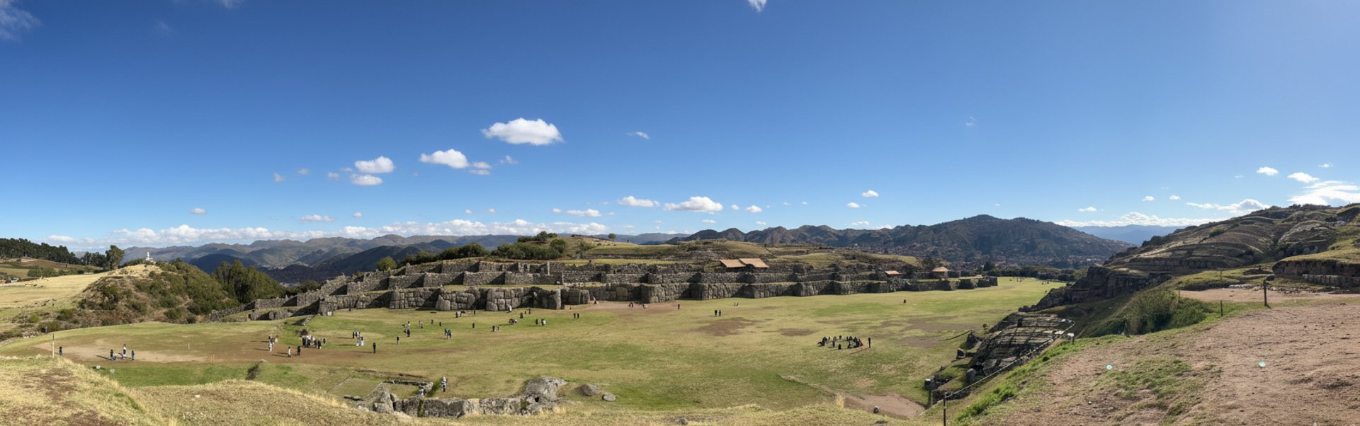 woman wearing yellow long-sleeved dress under white clouds and blue sky during daytime