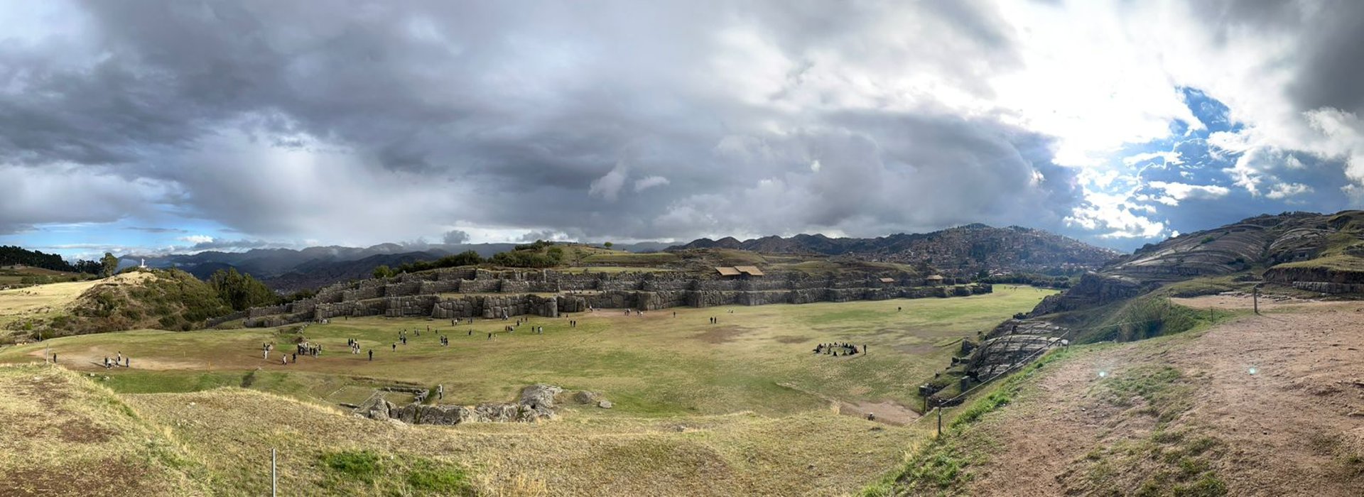 woman wearing yellow long-sleeved dress under white clouds and blue sky during daytime