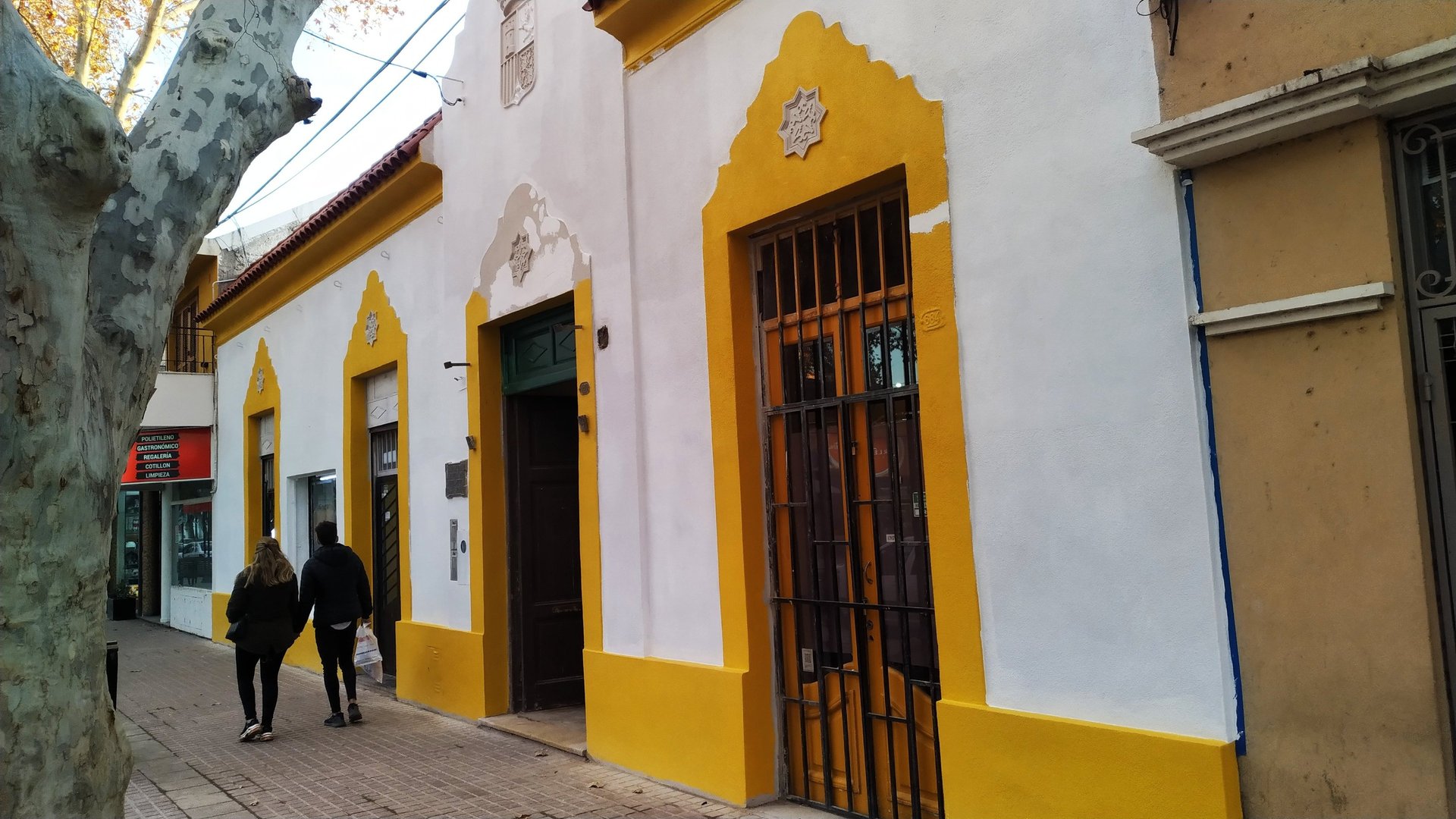 flag on pole beside building during day