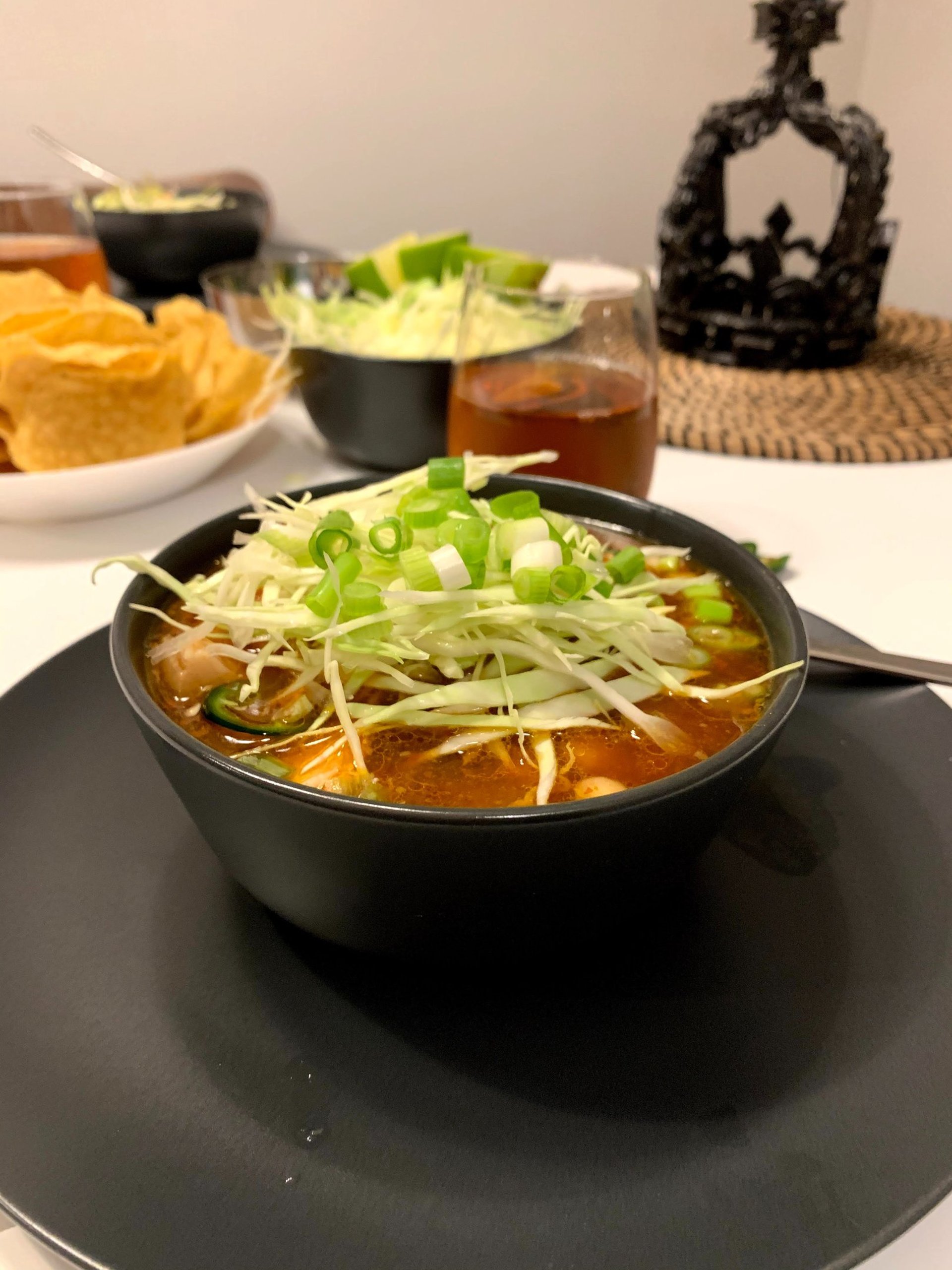 pink flowers beside clear drinking glass