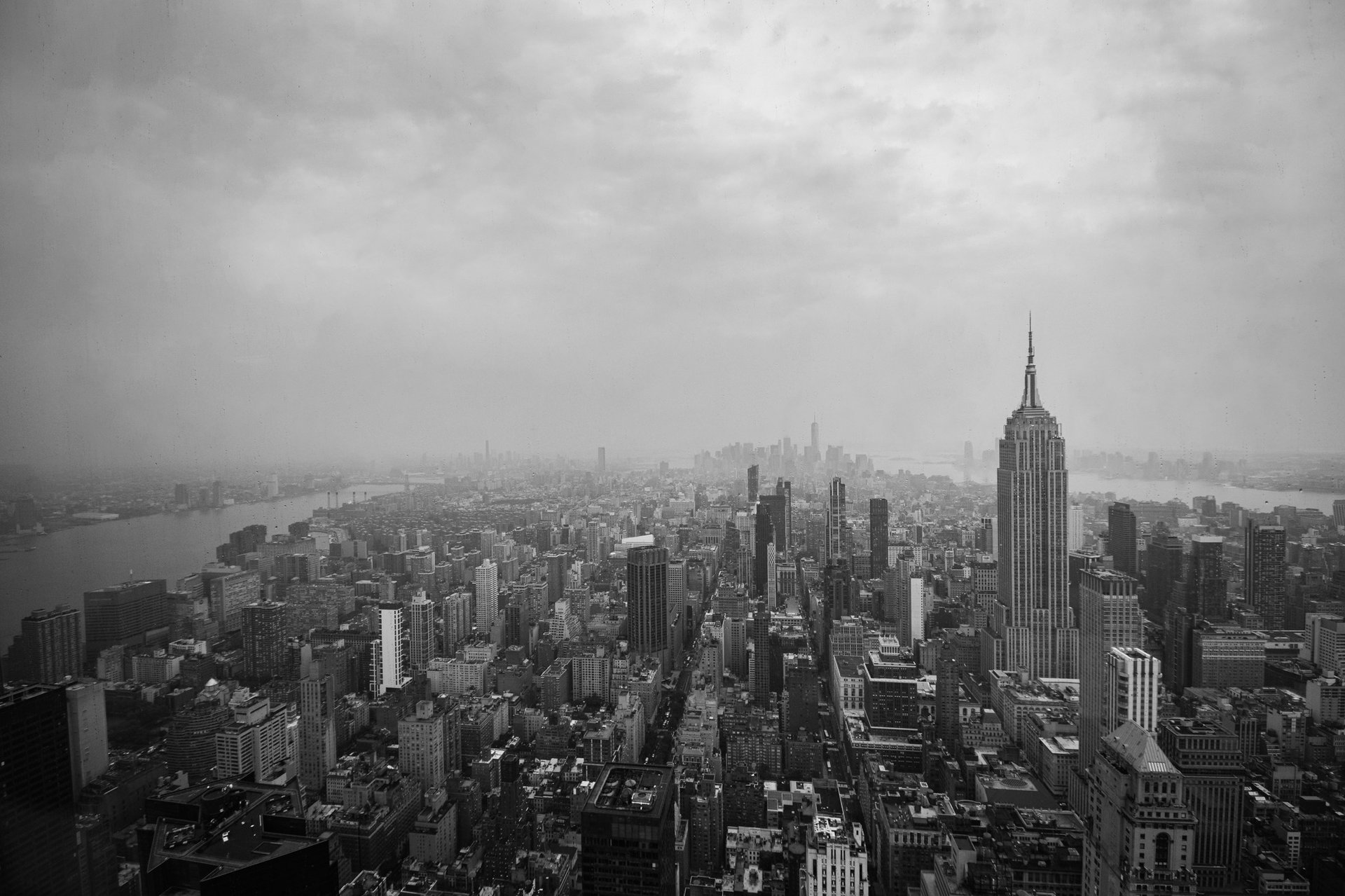 an abstract photo of a curved building with a blue sky in the background
