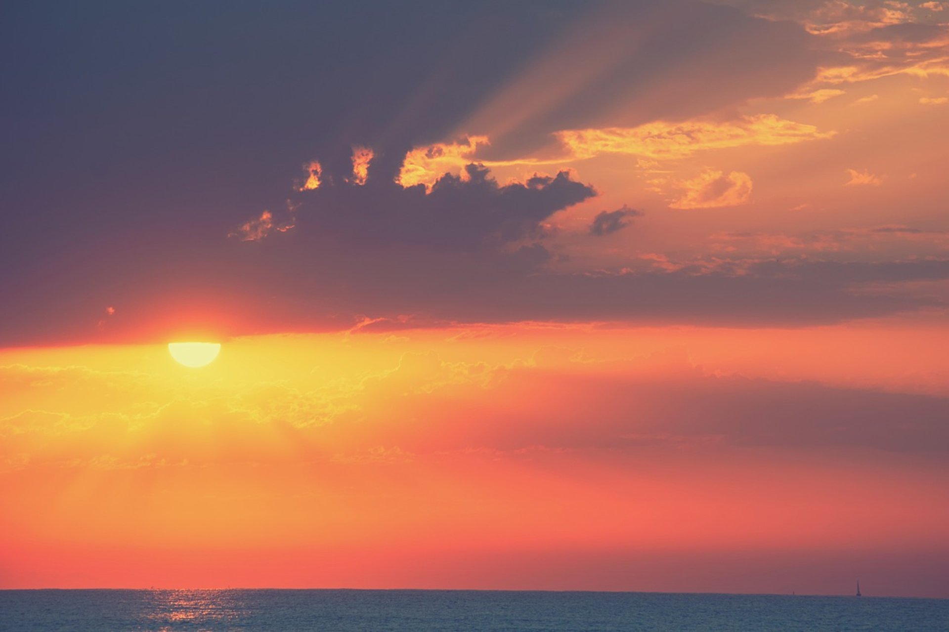 woman wearing yellow long-sleeved dress under white clouds and blue sky during daytime
