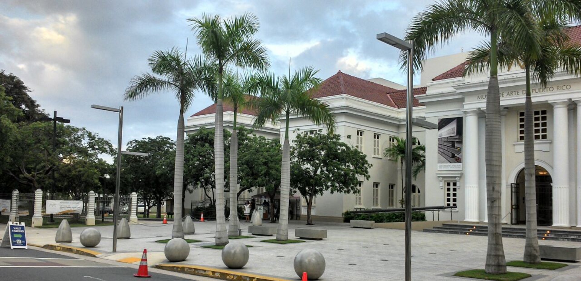 woman wearing yellow long-sleeved dress under white clouds and blue sky during daytime